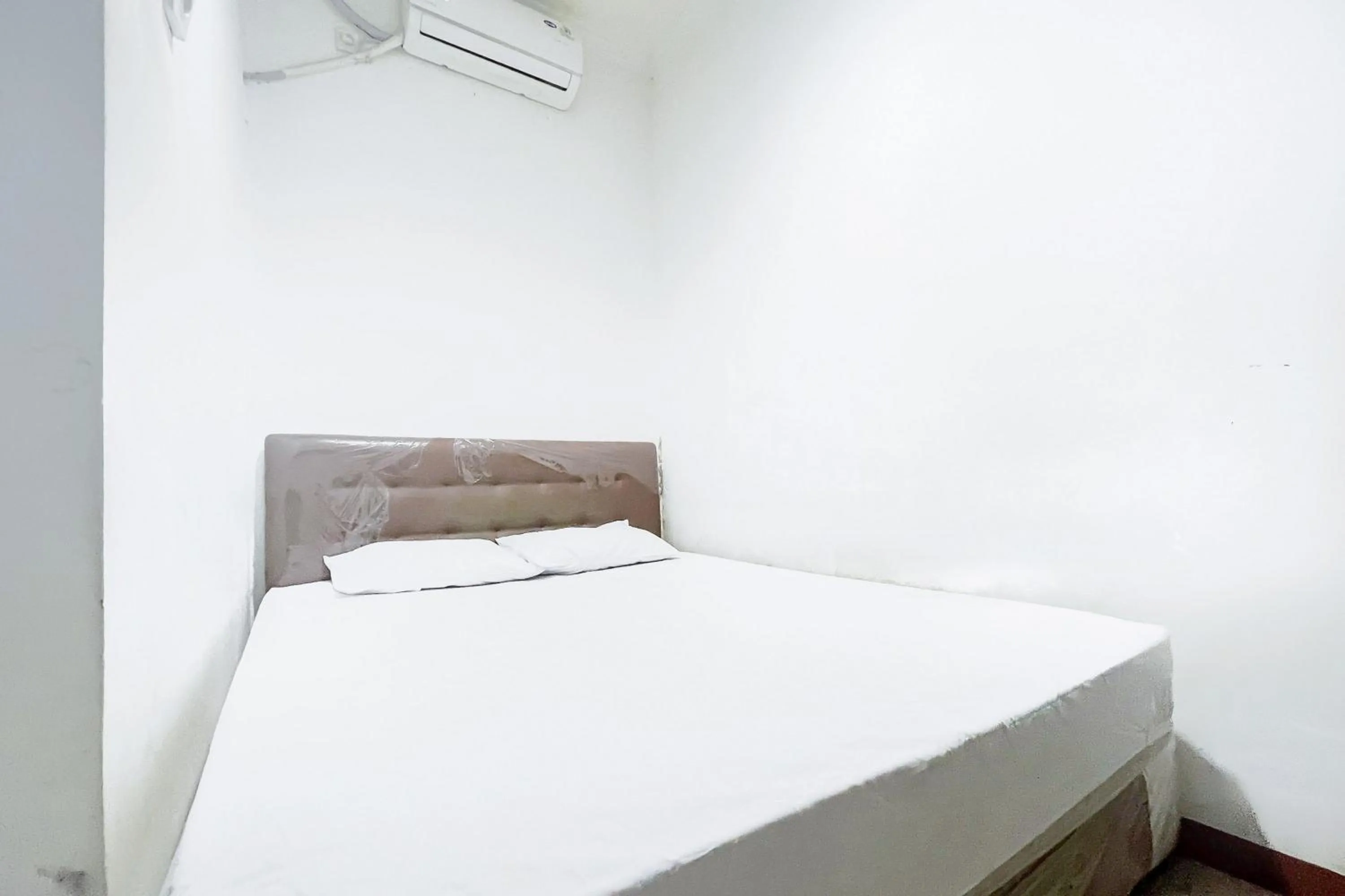 Bed in Citara Jaya Guesthouse Mitra RedDoorz