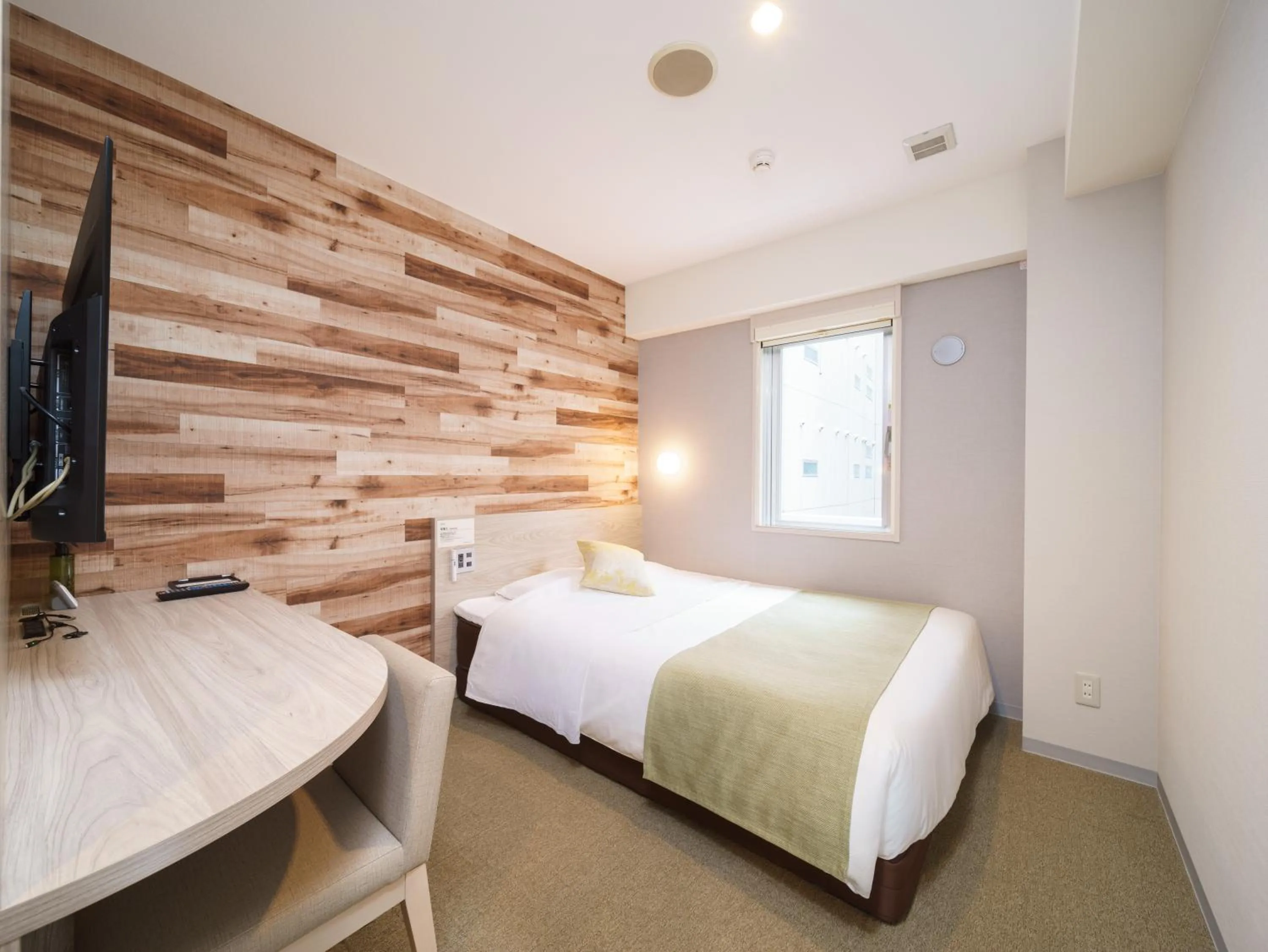 Bed in Super Hotel Sendai Hirose Dori