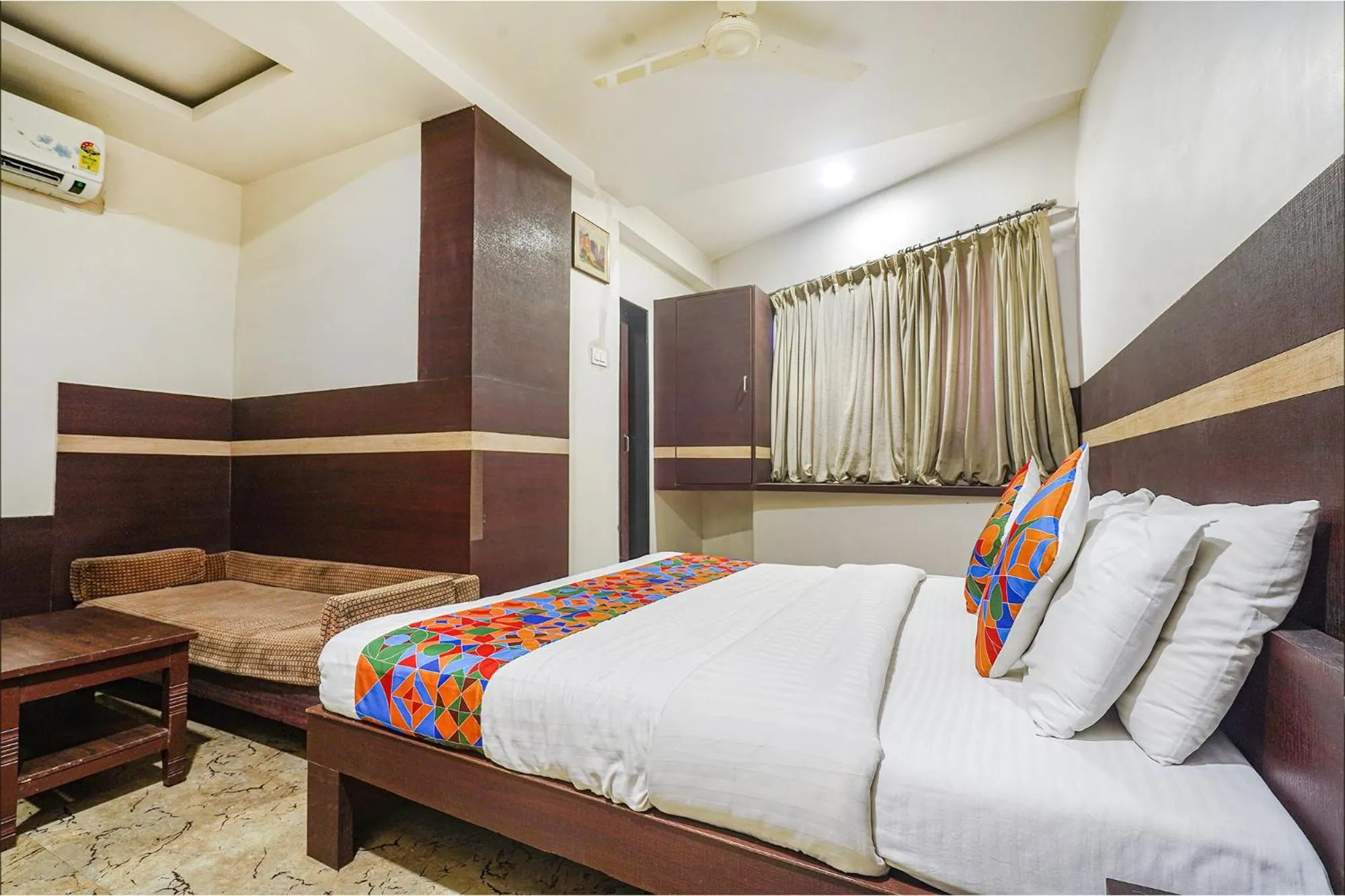 Bed in FabHotel Shravan - Nr Eternity Mall