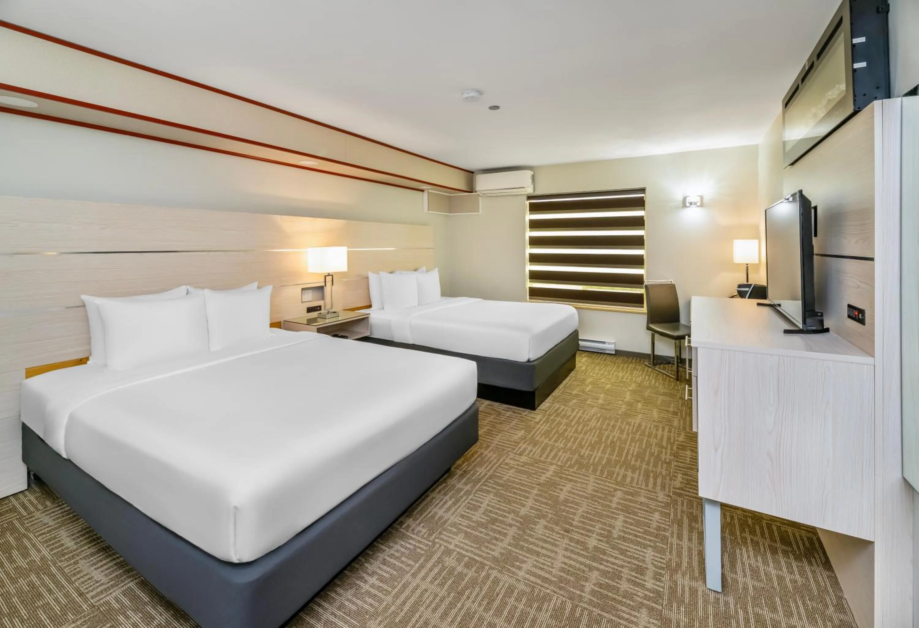 Bed in Quality Inn Sunshine Suites