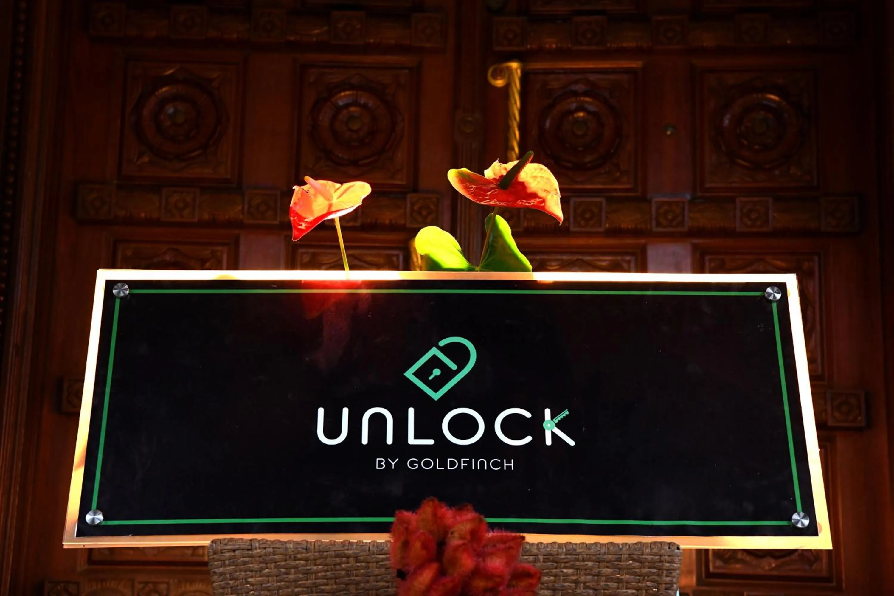 Property logo or sign in Unlock By Goldfinch Sakaleshpur