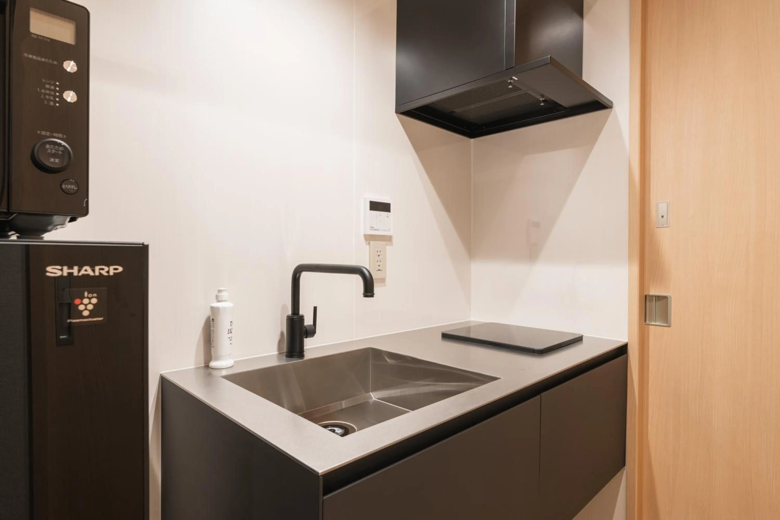 Kitchen or kitchenette in GRAND BASE Hakata Gofuku