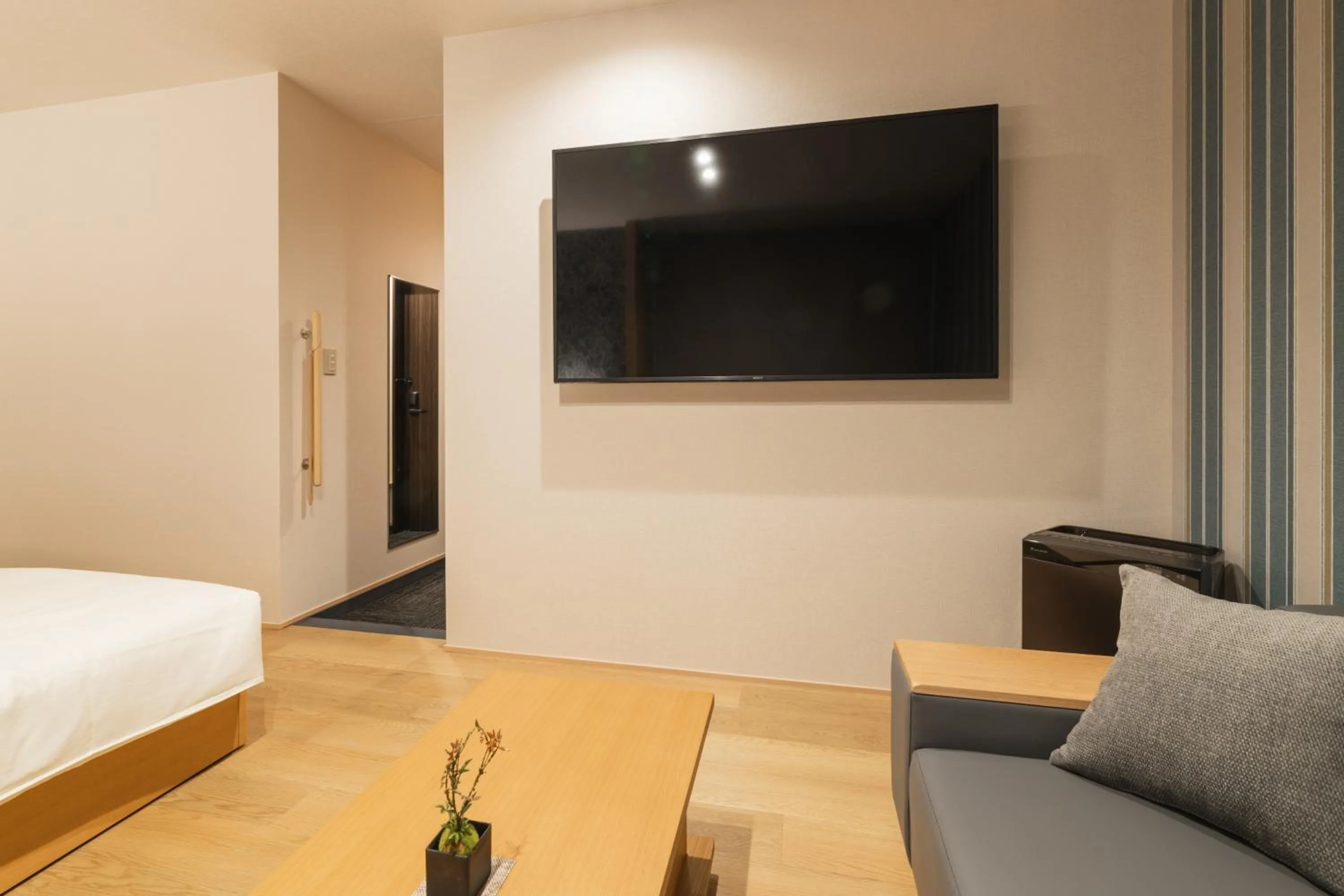 Seating area, Bed in GRAND BASE Hakata Gofuku