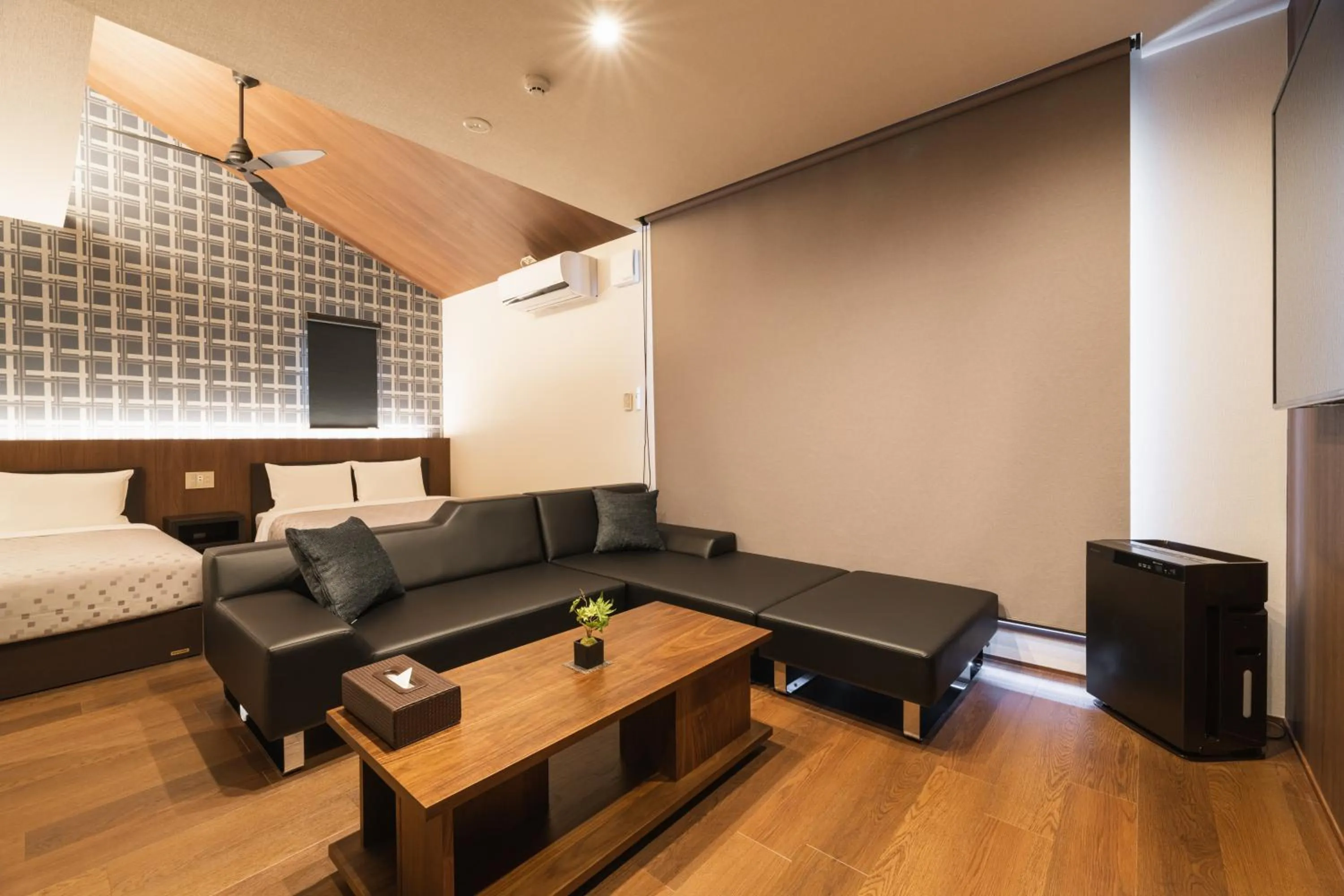 Seating area, Bed in GRAND BASE Hakata Gofuku