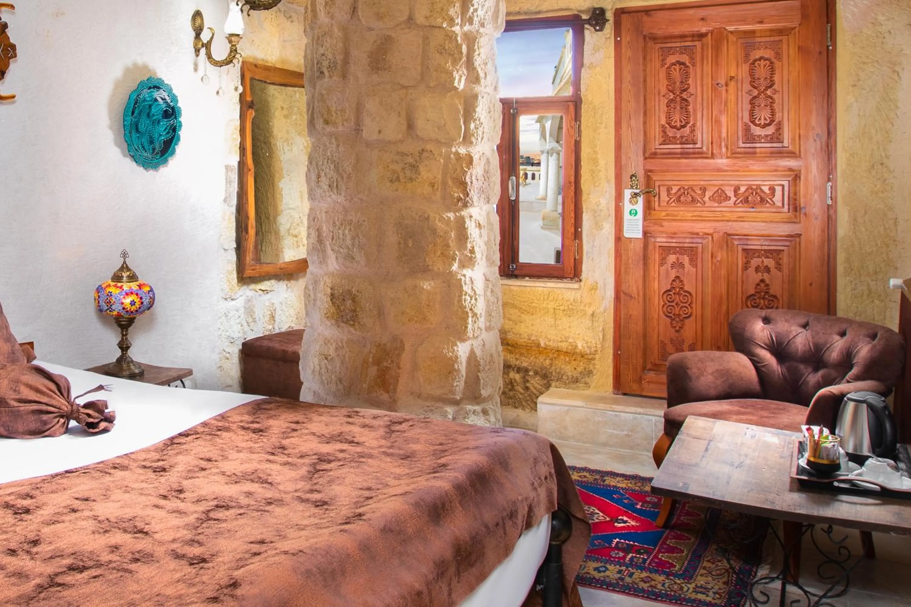 Seating area, Bed in Romantic Cave Hotel