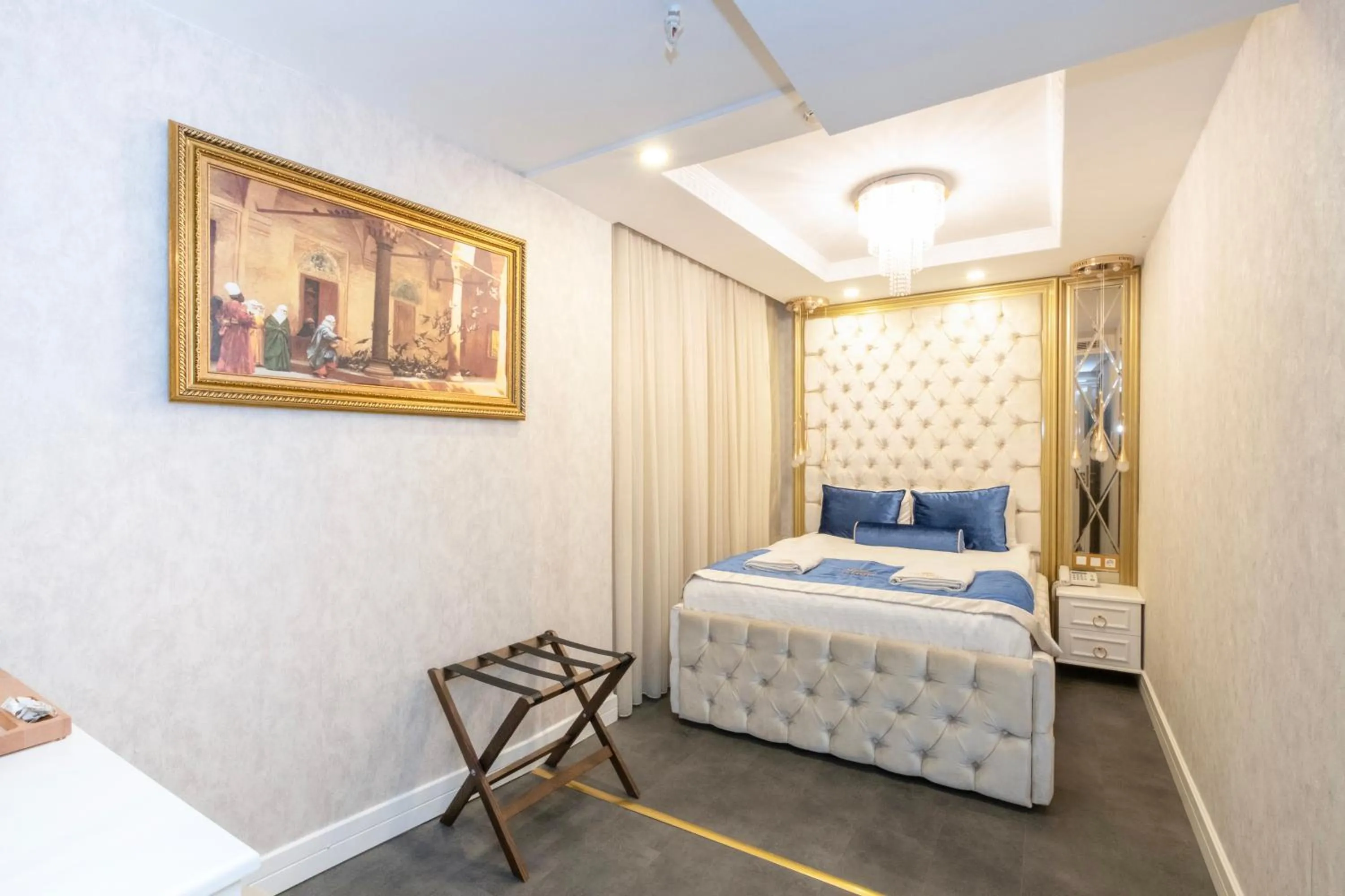 Bed in Leslion Luxury Hotel