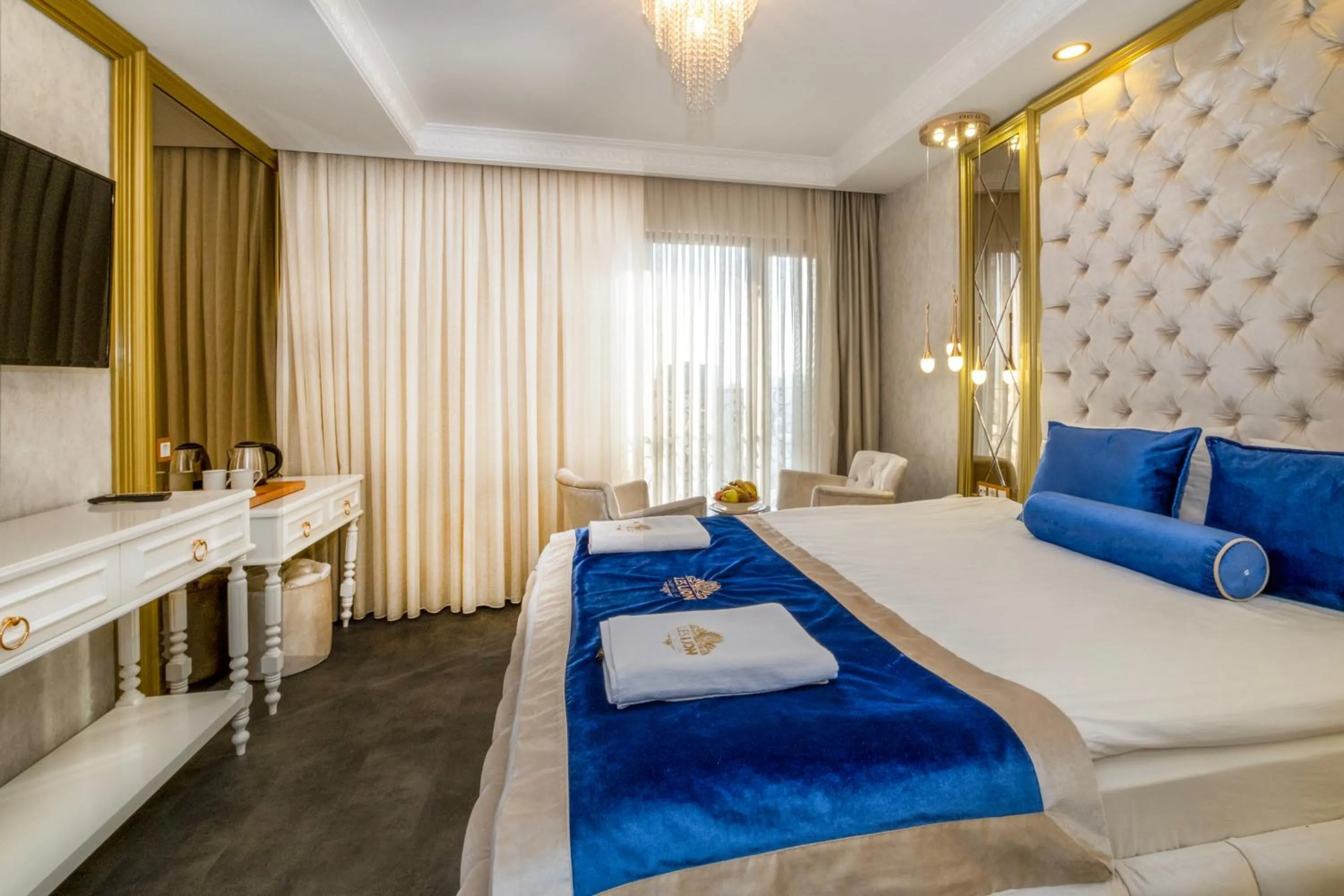 Bed in Leslion Luxury Hotel