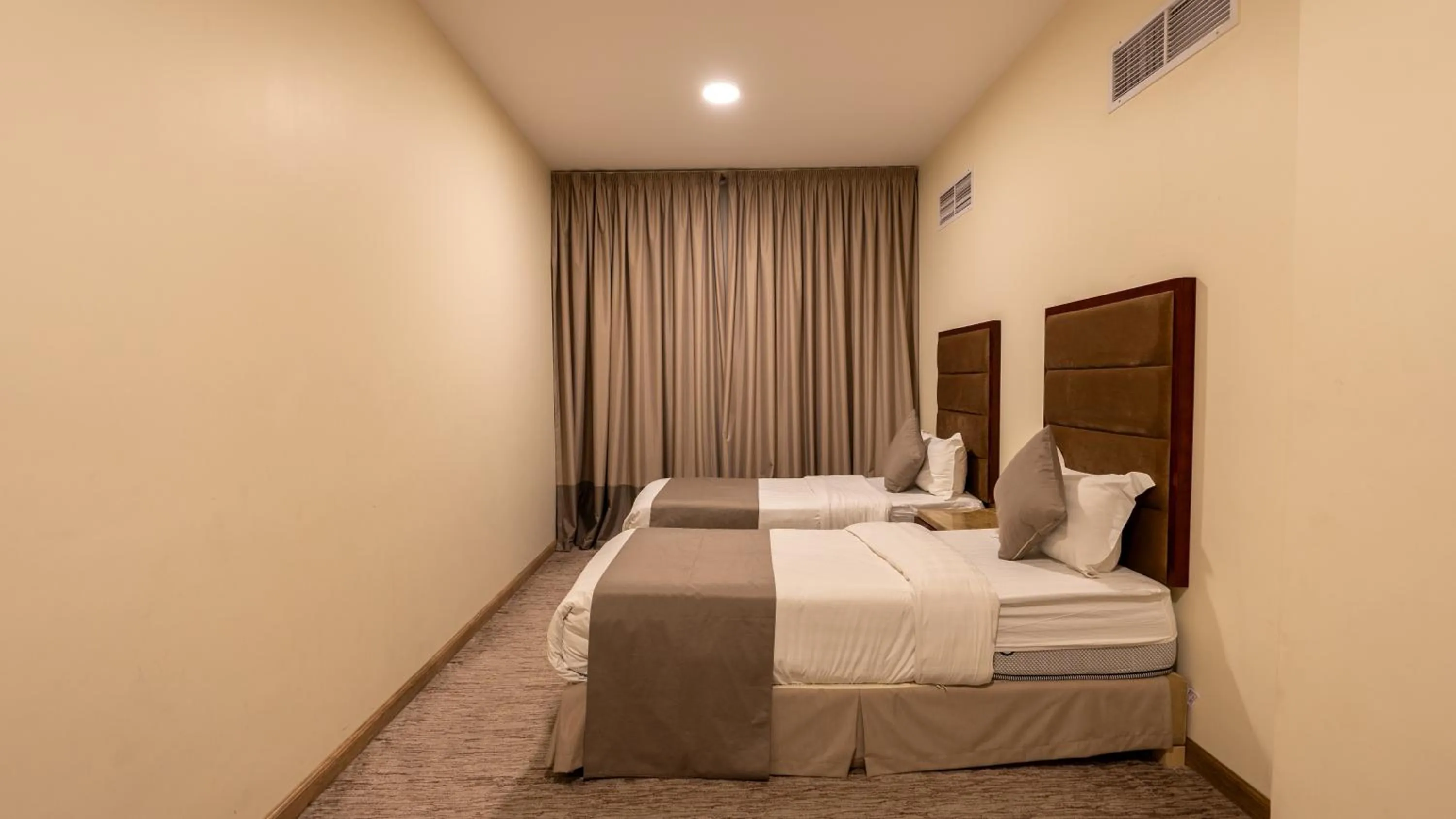 Bed in شقق مسكن المدينة للشقق المخدومة