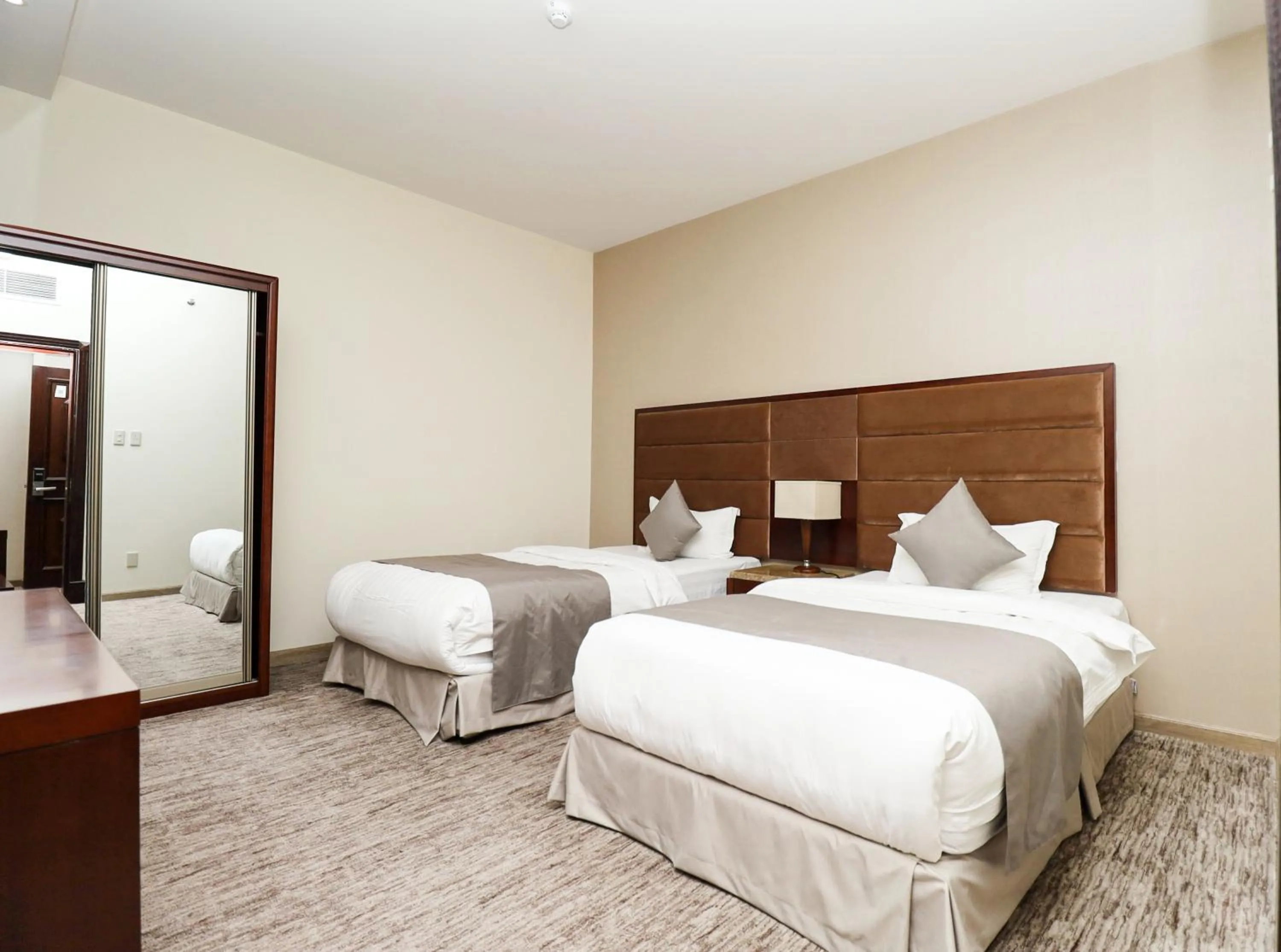 Bed in شقق مسكن المدينة للشقق المخدومة