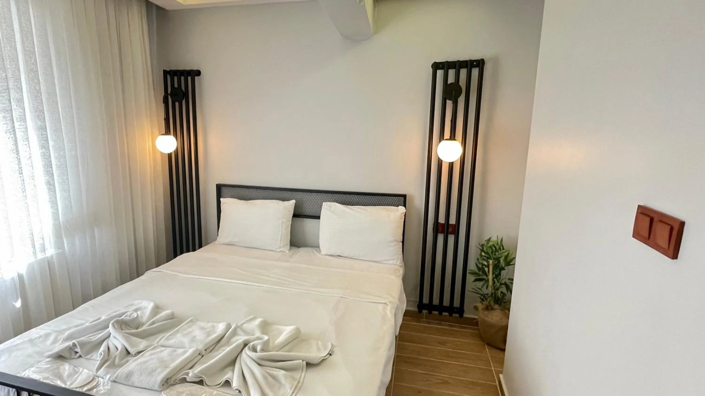 Bed in Ora Bella Hotel