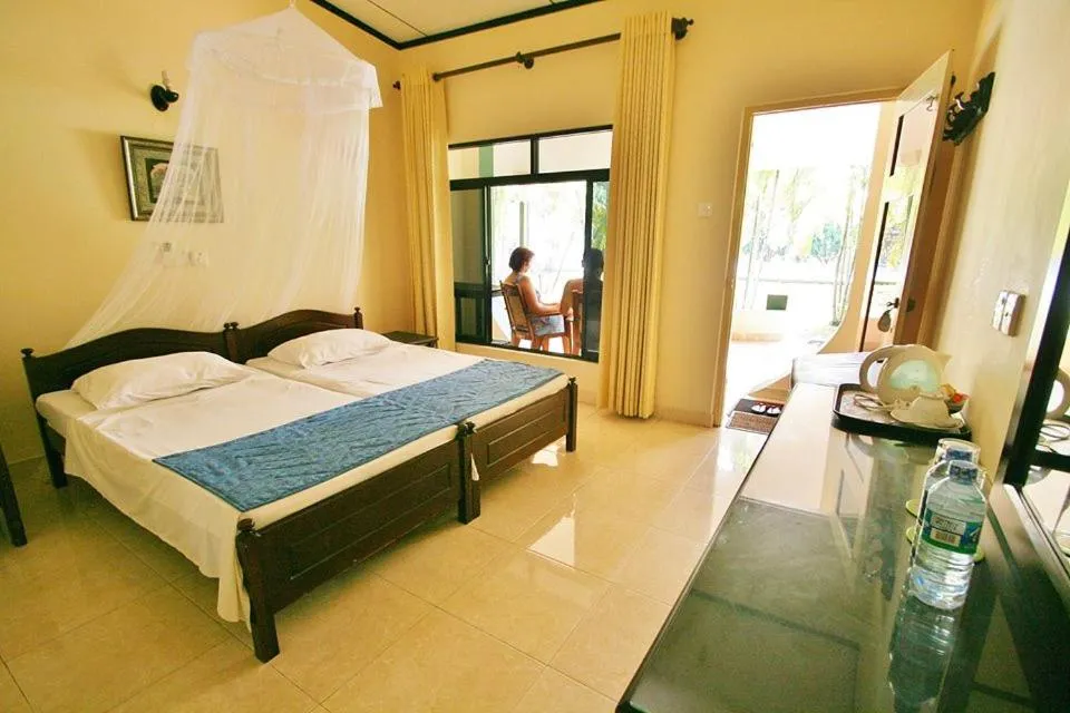Photo of the whole room, Bed in Sagarika Beach Hotel