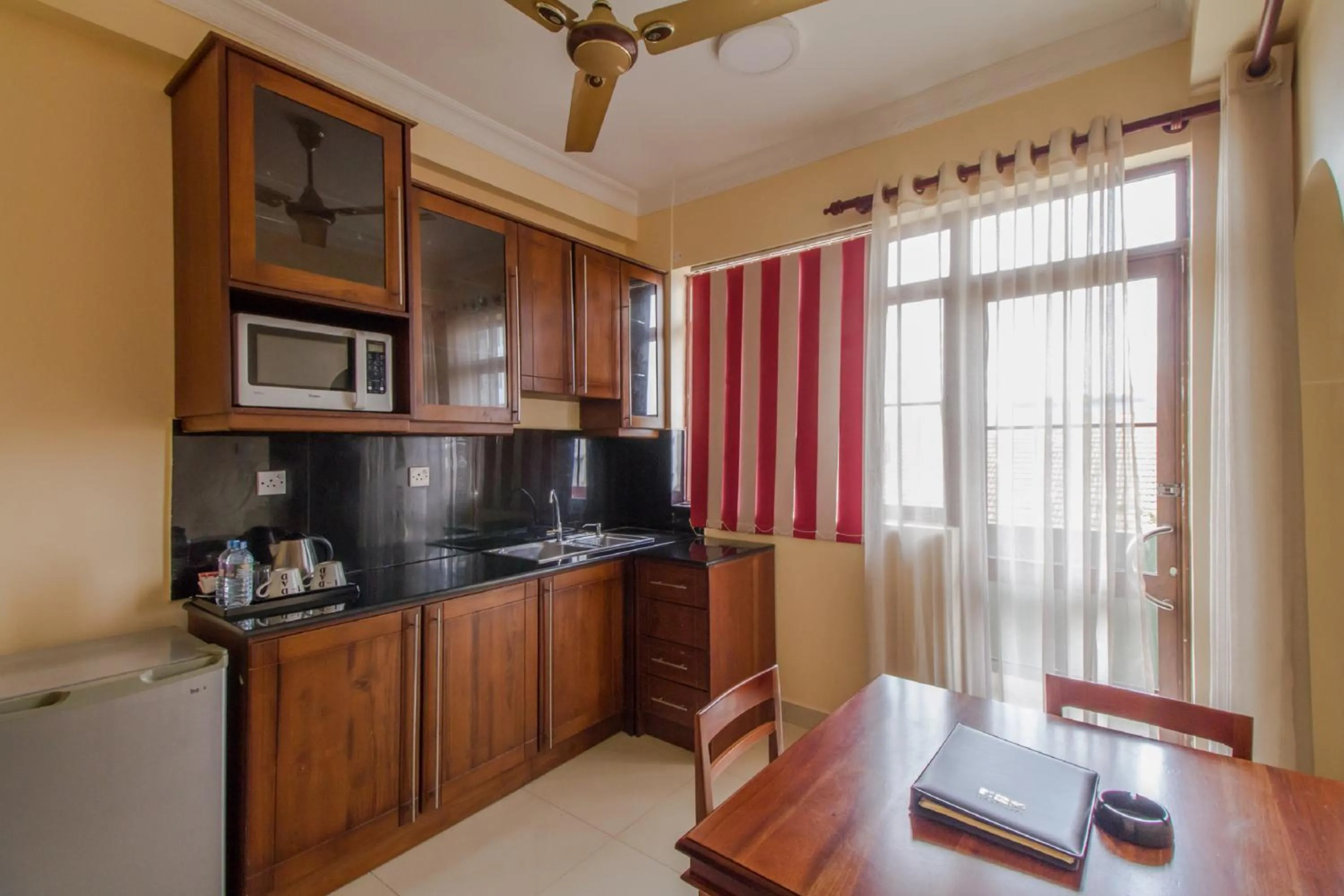 Kitchen or kitchenette in Lafala Hotel & Service Apartment