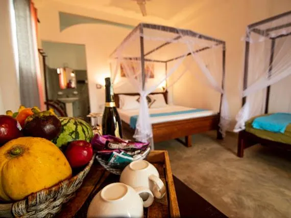 Bed in Frangipani Beach Villa