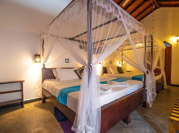 Bed in Frangipani Beach Villa
