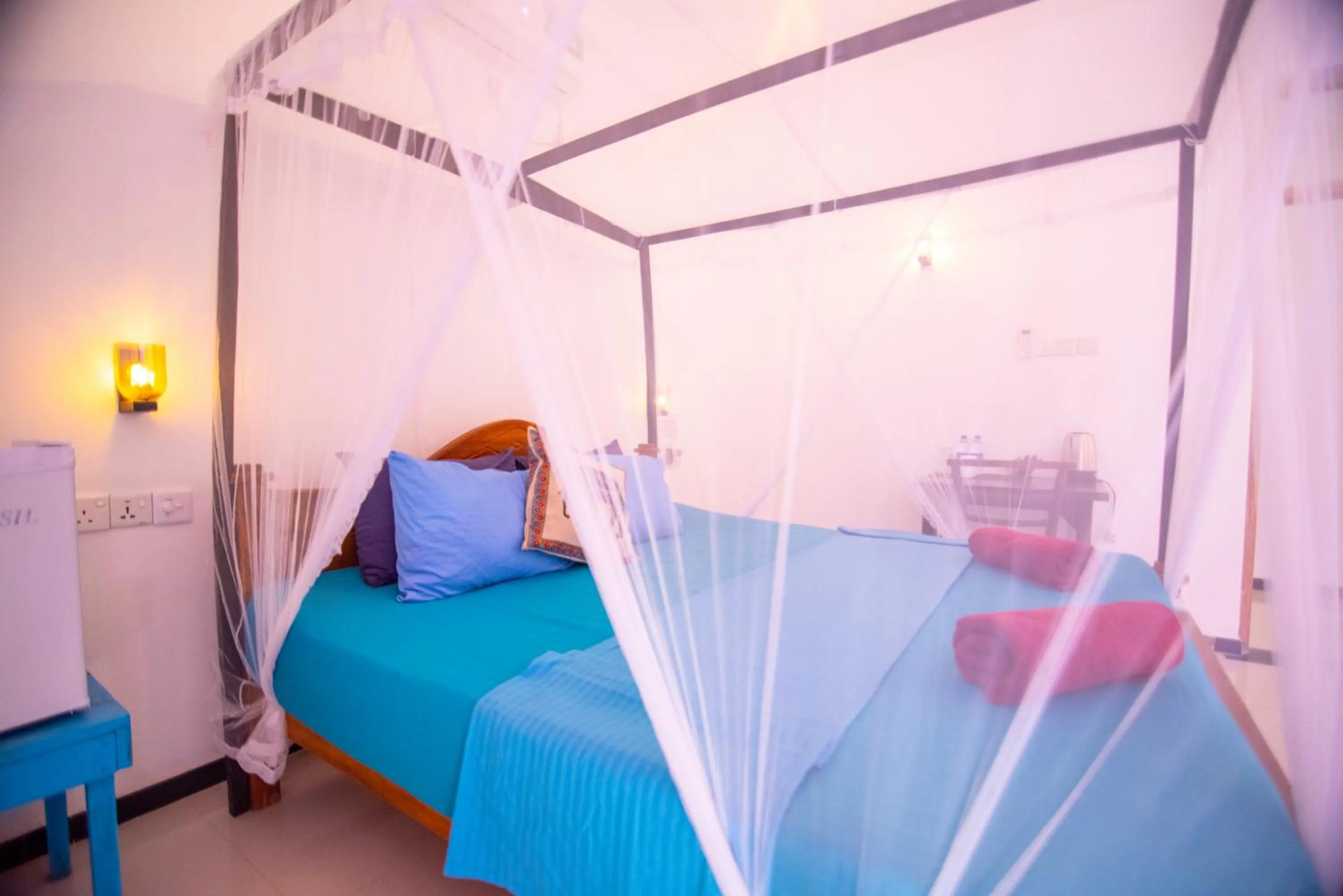 Bed in Frangipani Beach Villa