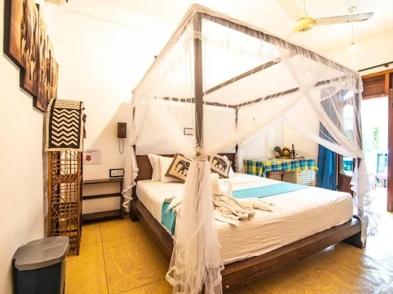 Bed in Frangipani Beach Villa