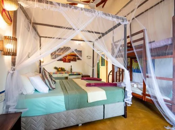 Bed in Frangipani Beach Villa
