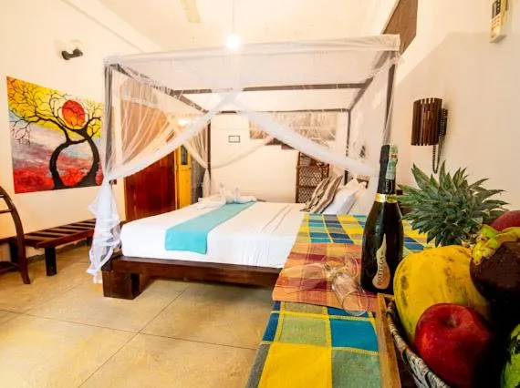 Bed in Frangipani Beach Villa