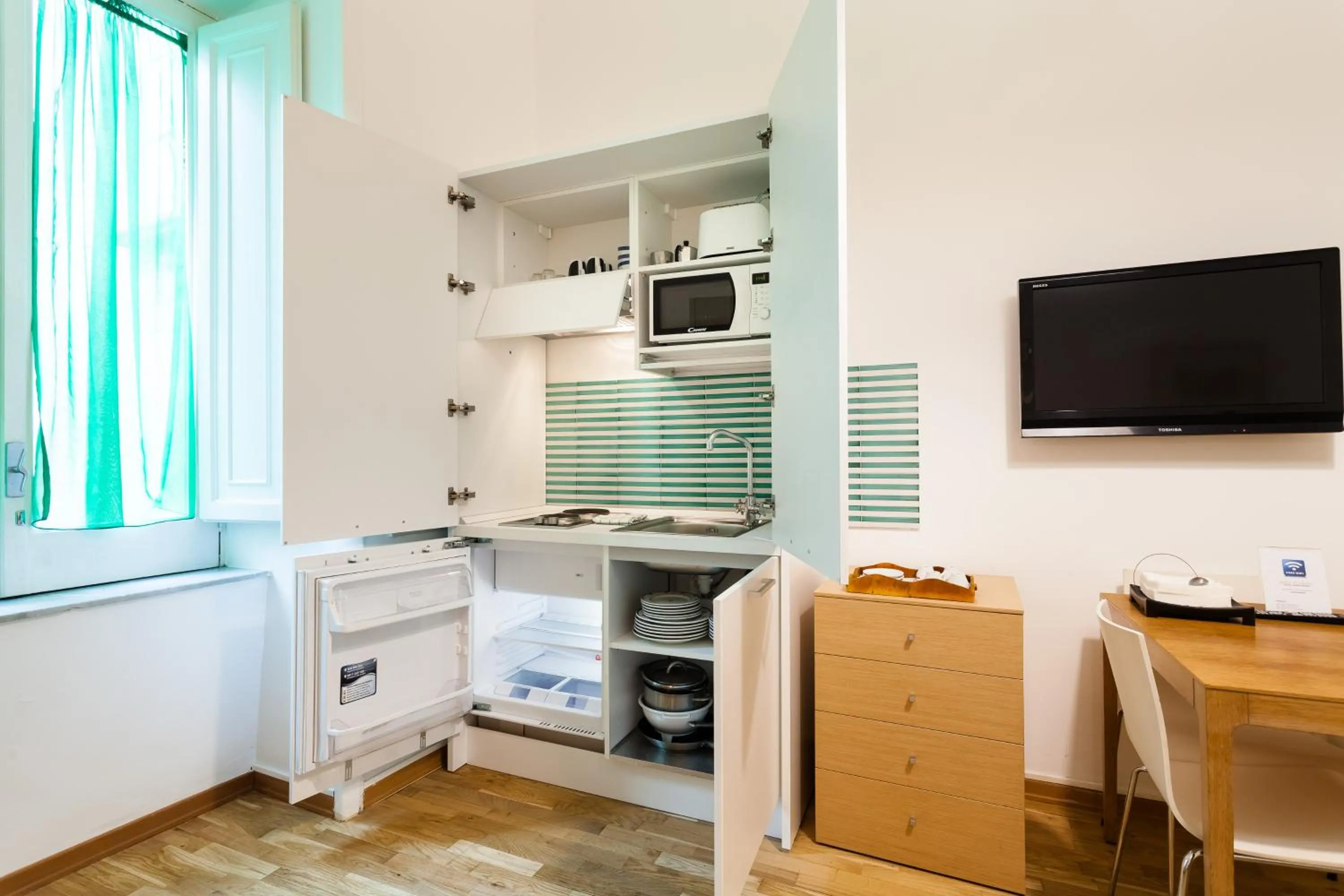 Kitchen or kitchenette in Corso Italia Suites