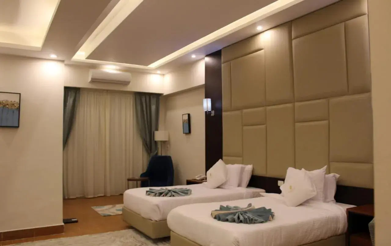 Double or Twin Room with Side Sea View and Garden View in Royal Jewel Al Raml Hotel Double or Twin Room with Side Sea View and Garden View in Royal Jewel Al Raml Hotel