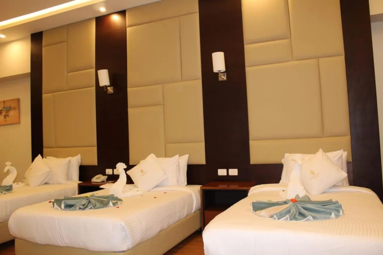 Bedroom, Bed in Royal Jewel Al Raml Hotel