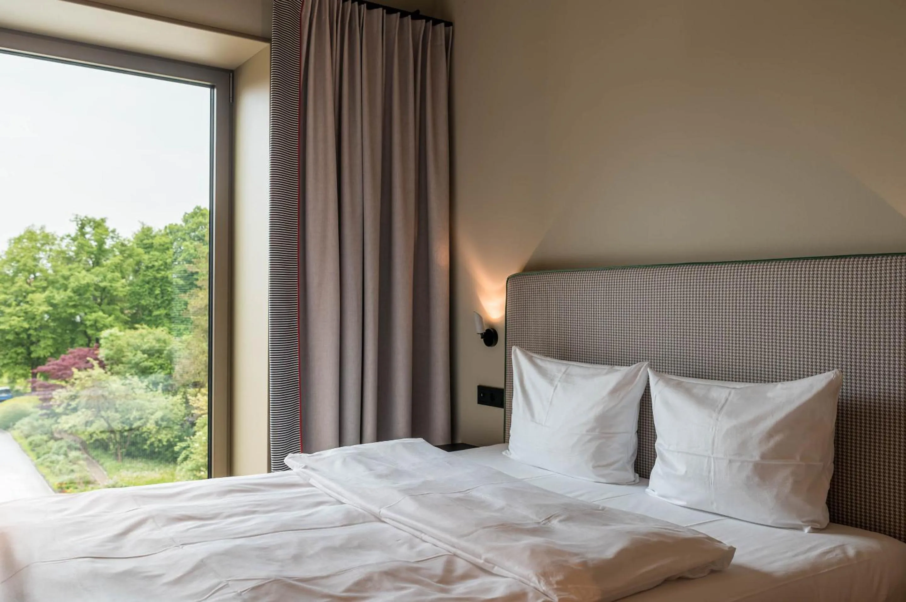 Bed in Hotel Miano by Limehome