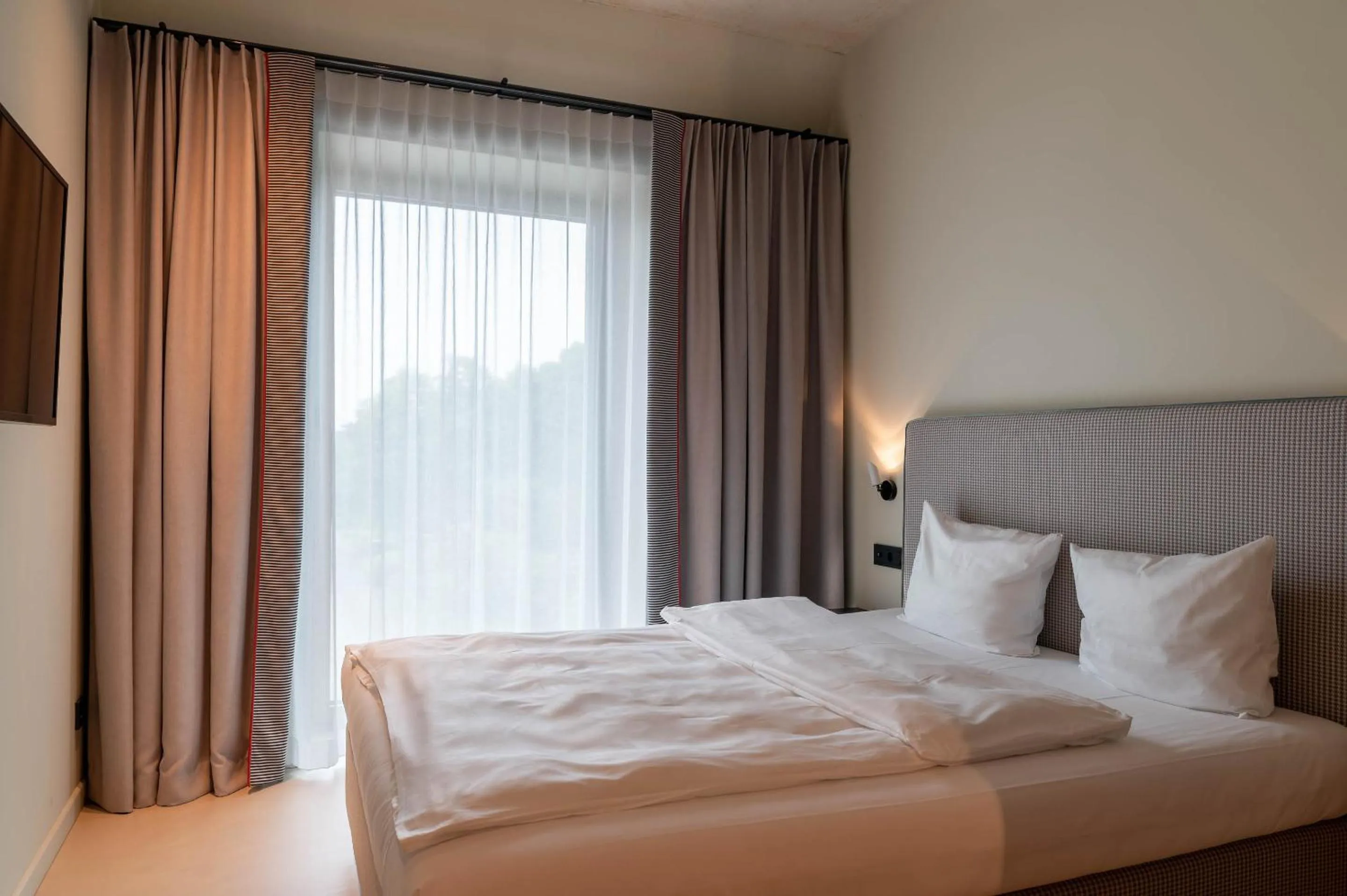 Bed in Hotel Miano by Limehome