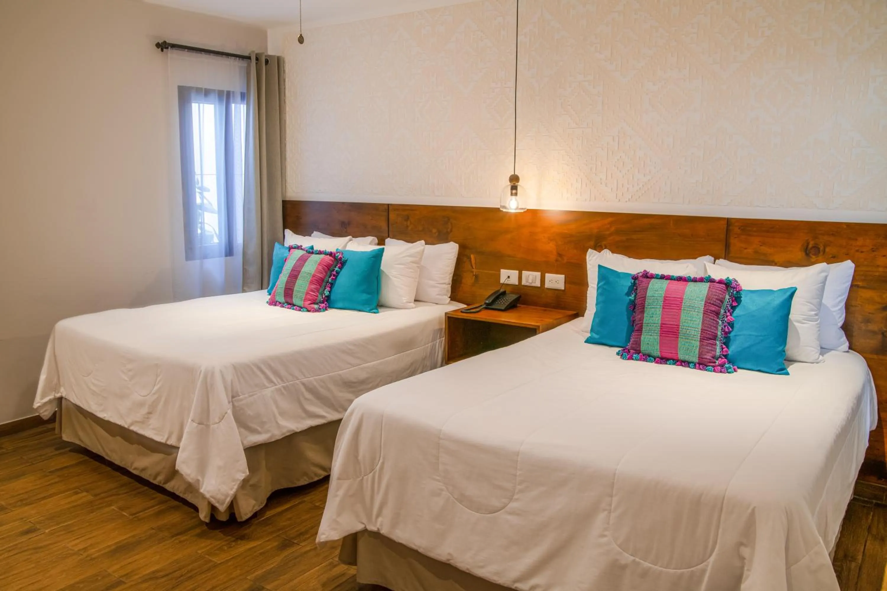 Bed in Hotel Las Camelias Inn by AHS