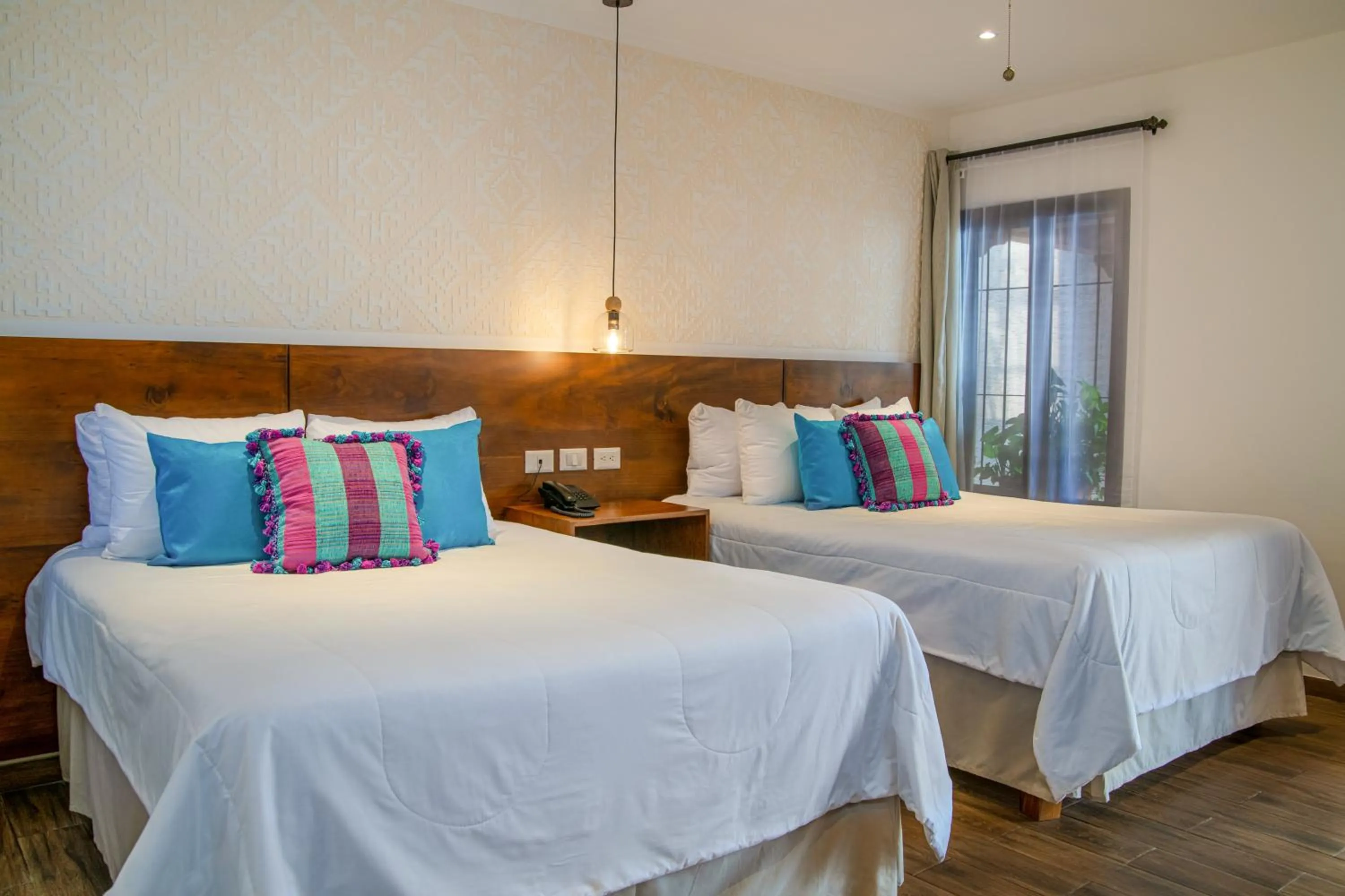 Bed in Hotel Las Camelias Inn by AHS