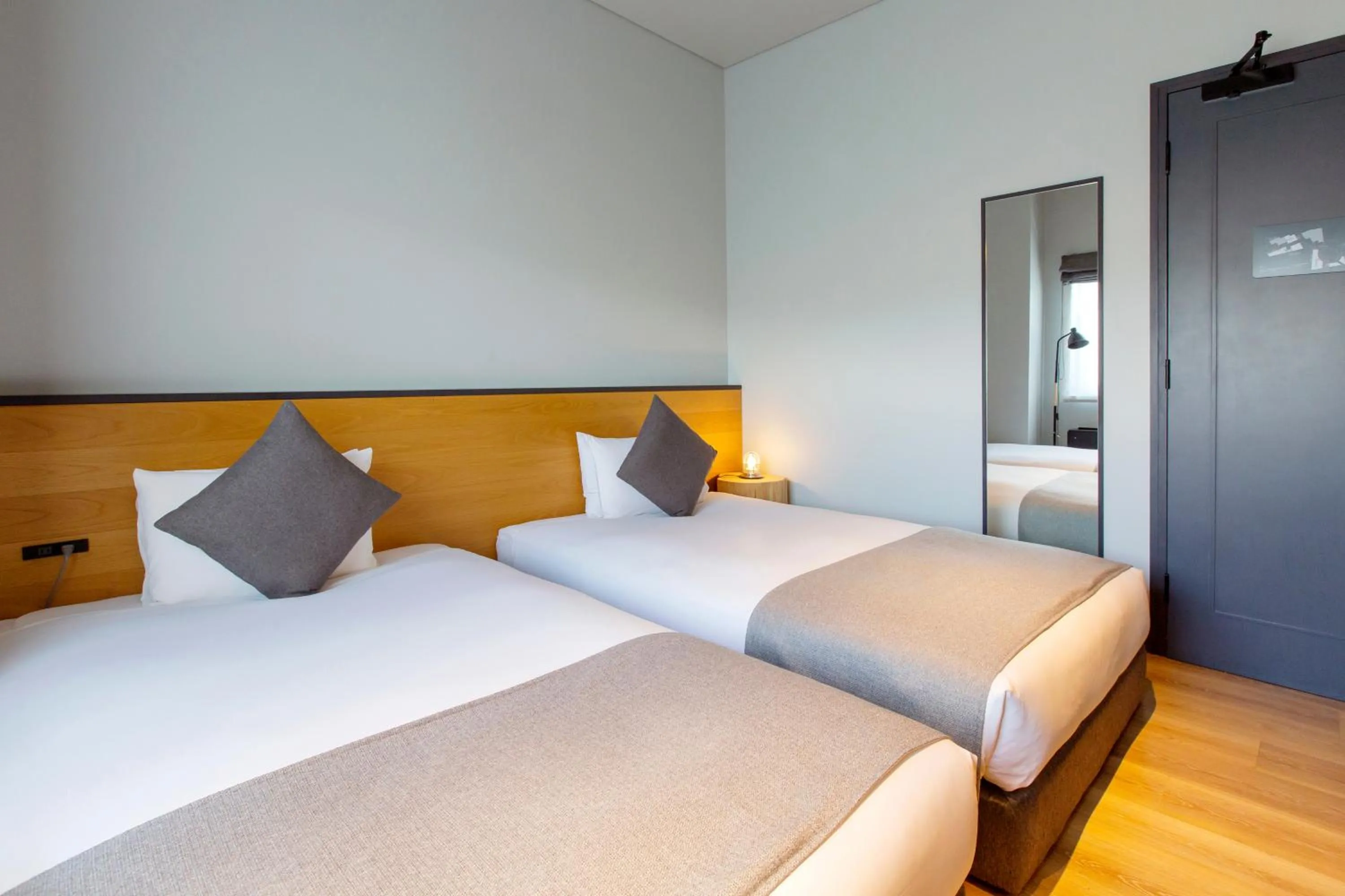 Bed in HOTEL KARUIZAWA CROSS