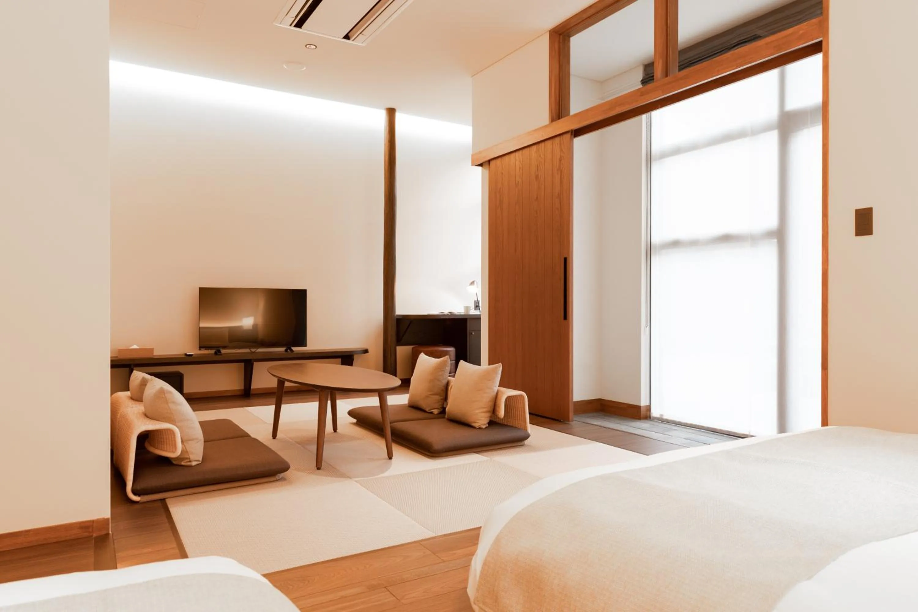 Bed in HOTEL KARUIZAWA CROSS