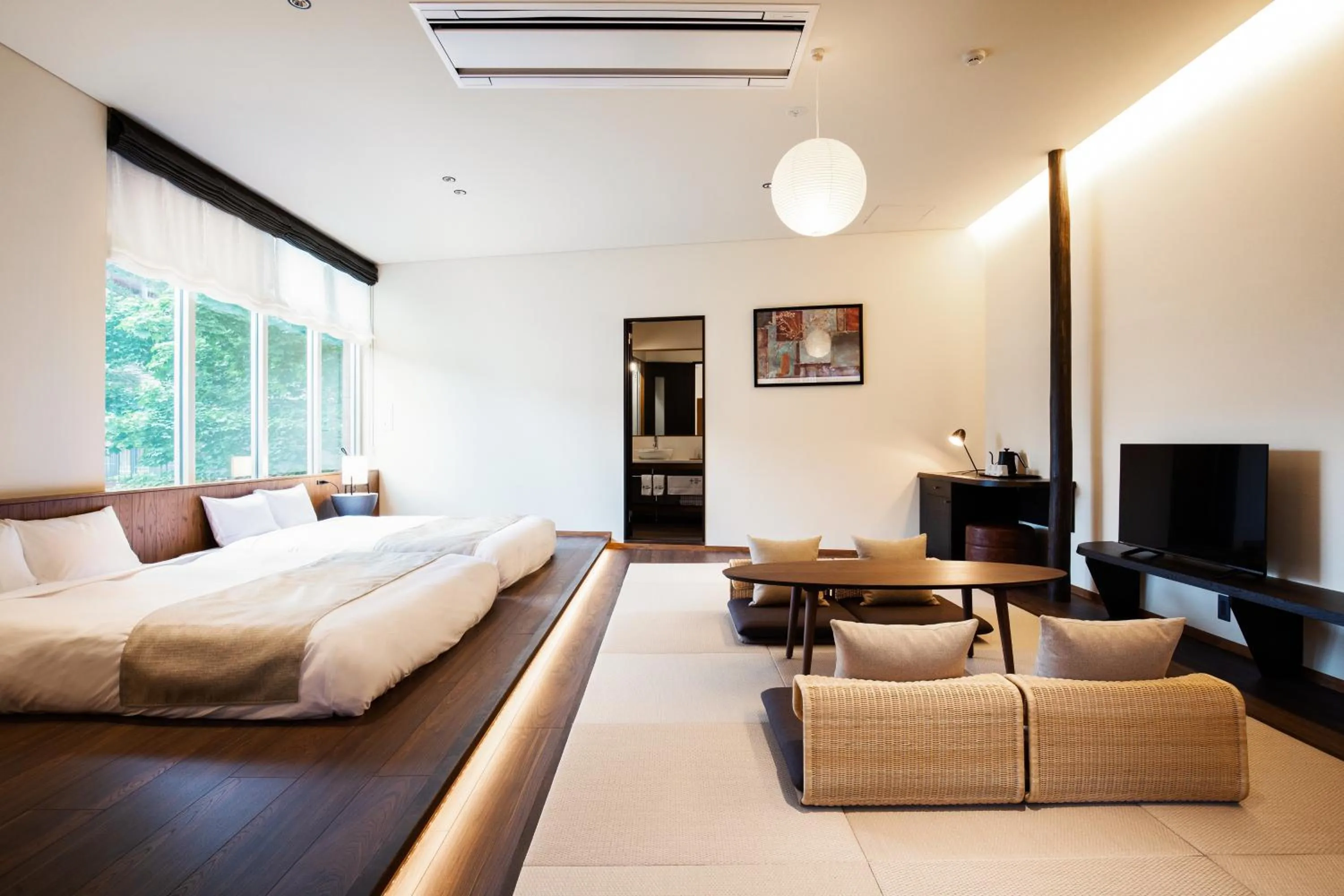 Bed in HOTEL KARUIZAWA CROSS