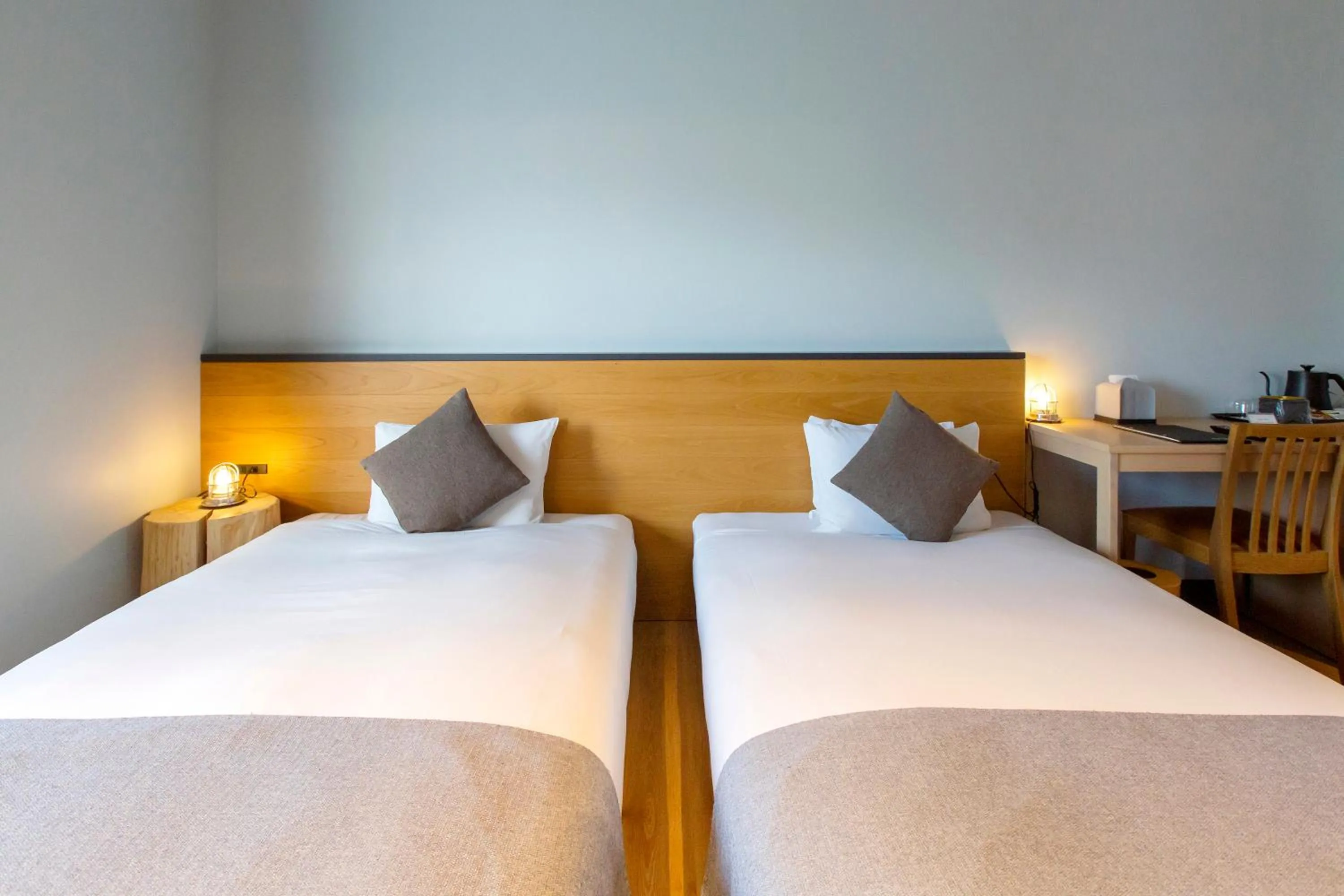 Bed in HOTEL KARUIZAWA CROSS