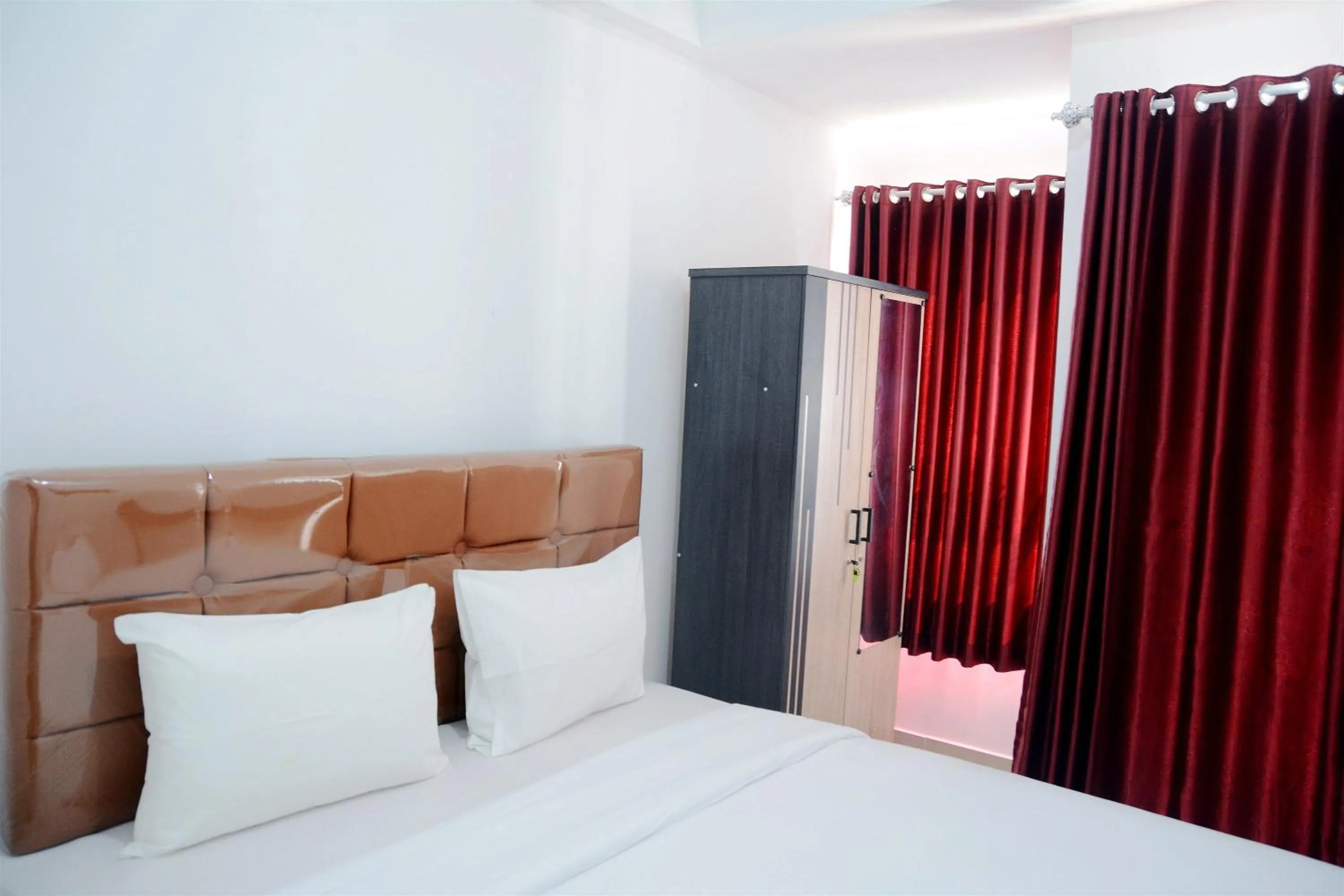 Bed in Comfy Studio Poris 88 Apartment By Travelio