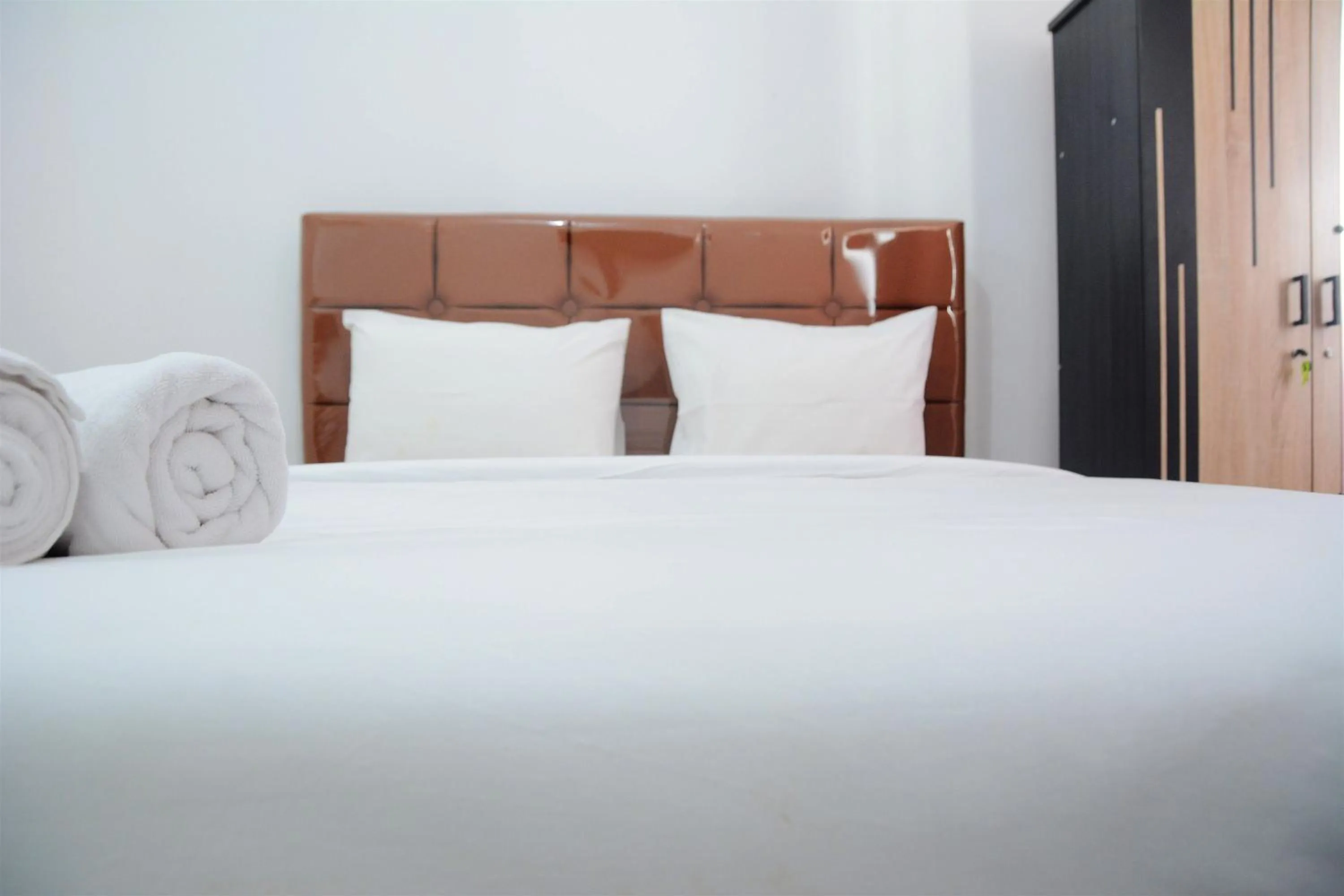 Bed in Comfy Studio Poris 88 Apartment By Travelio