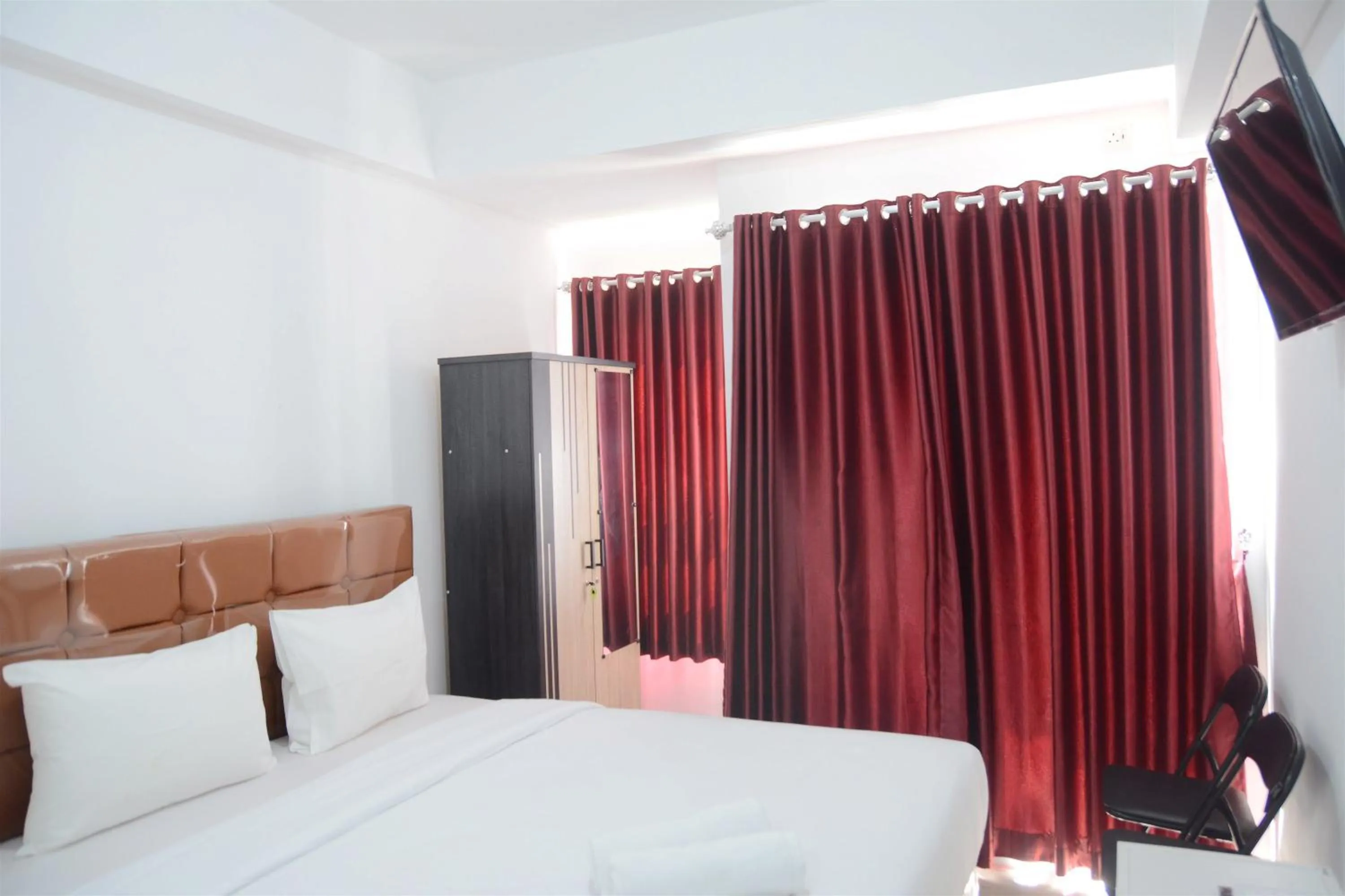 Bed in Comfy Studio Poris 88 Apartment By Travelio