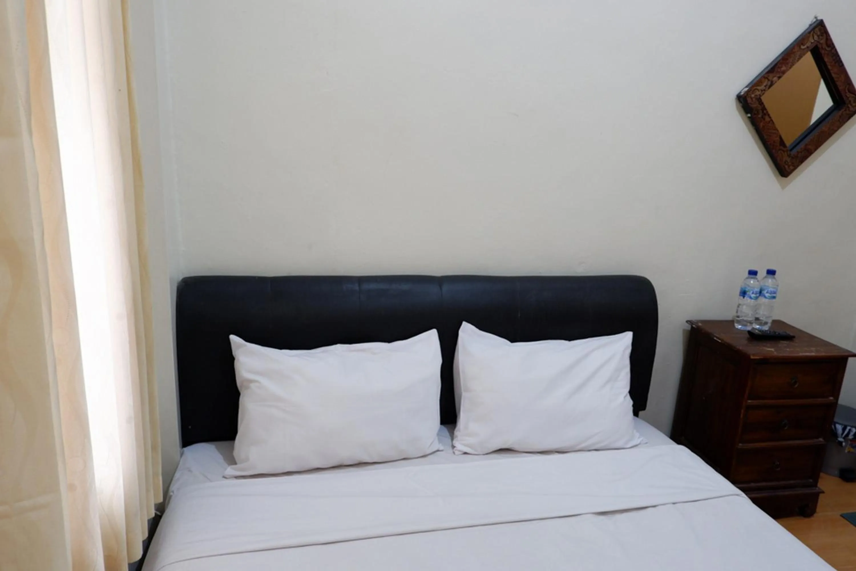 Bed in Khresna Guest House Malioboro Mitra RedDoorz