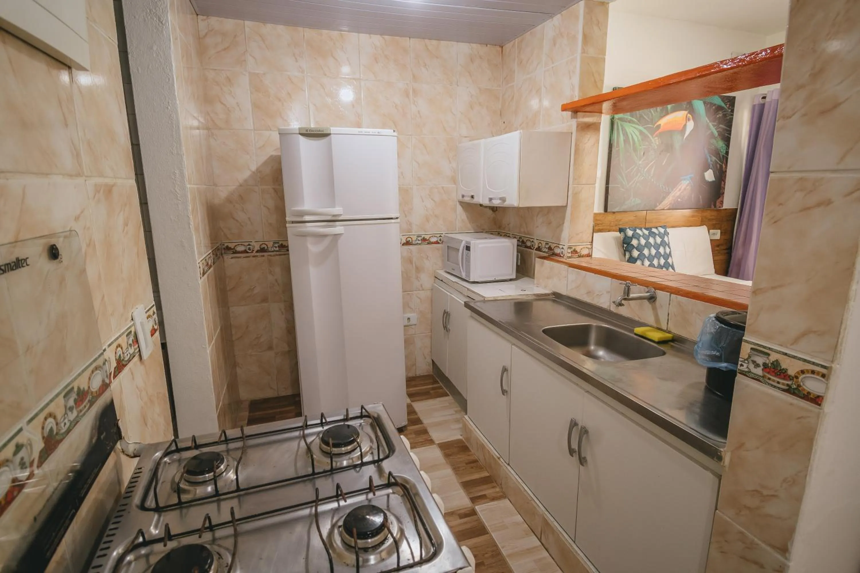 Kitchen or kitchenette in Pousada Porto Amazônia