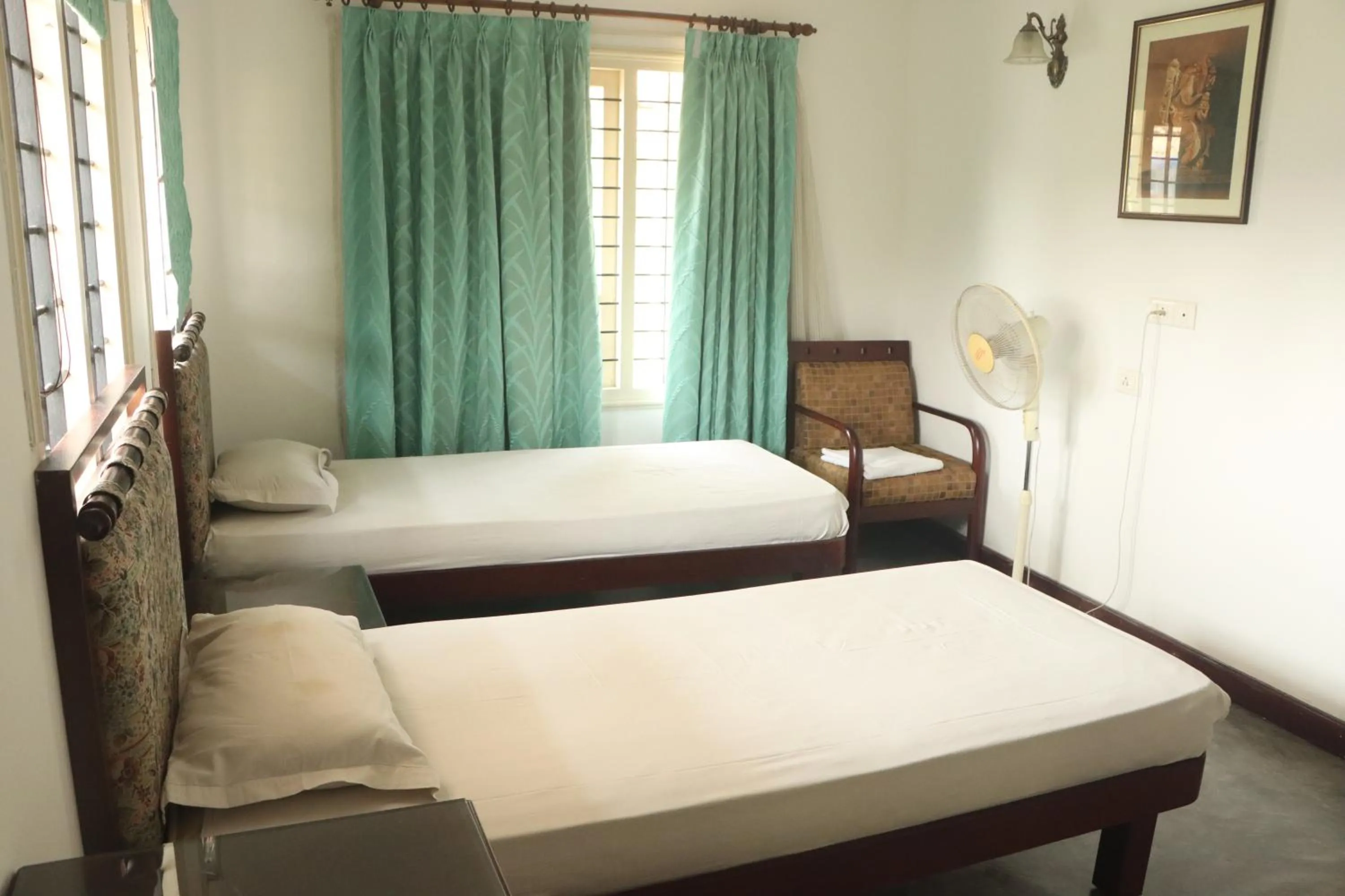 Bed in Fortbeach Service Apartments