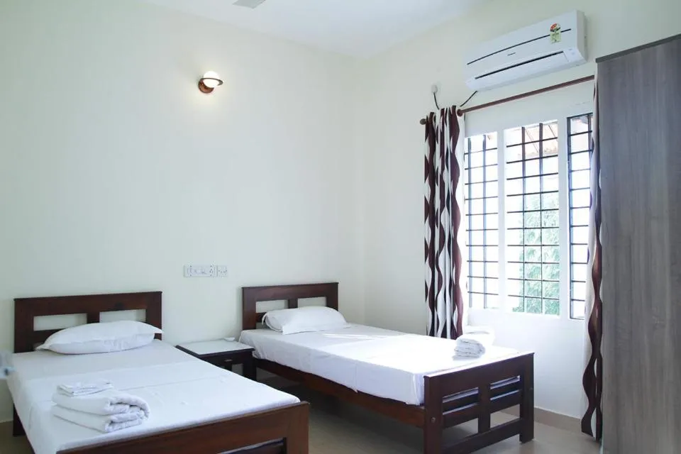 Bed in Fortbeach Service Apartments