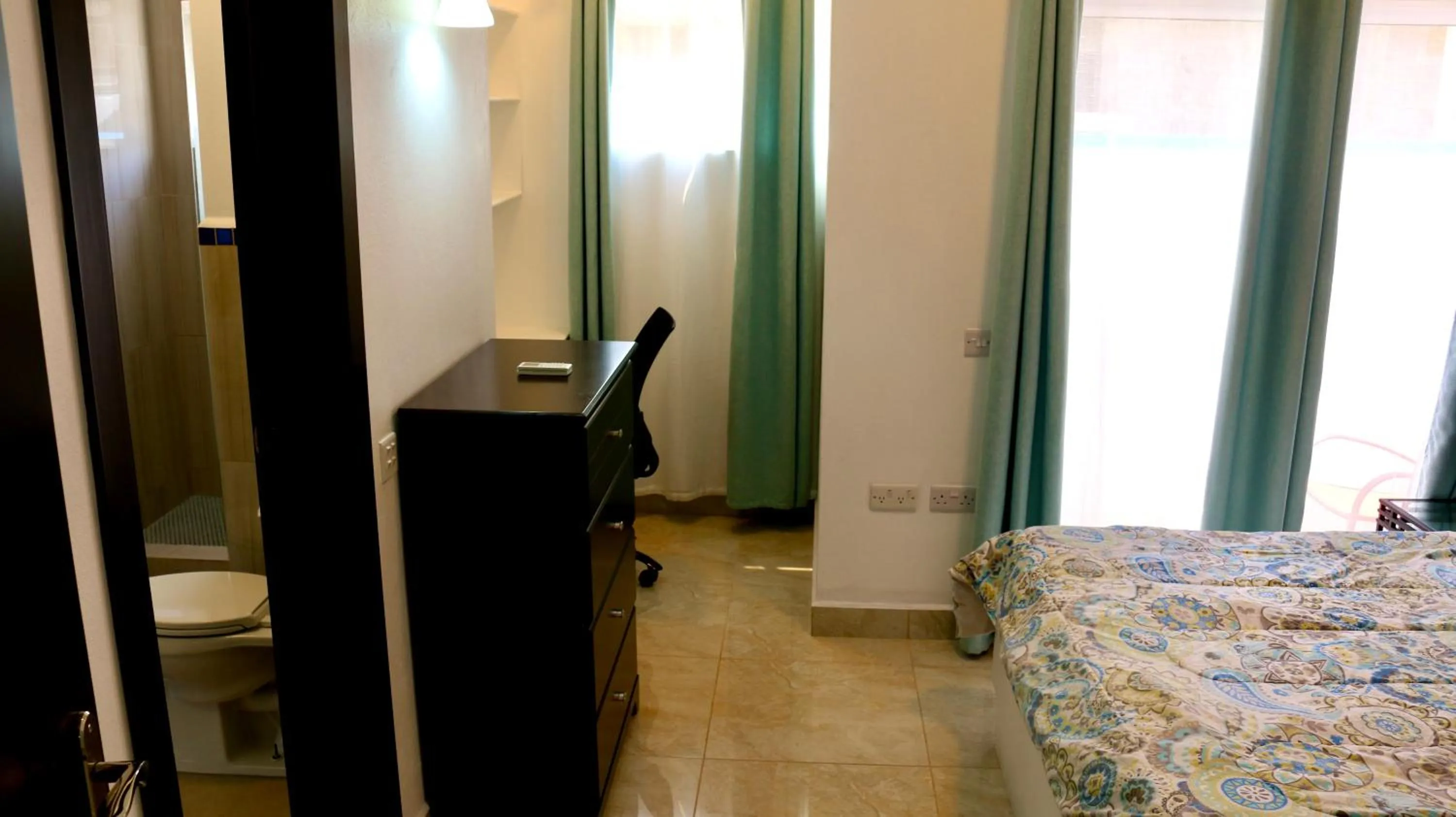 Bed in Blue Star Apartments & Hotel