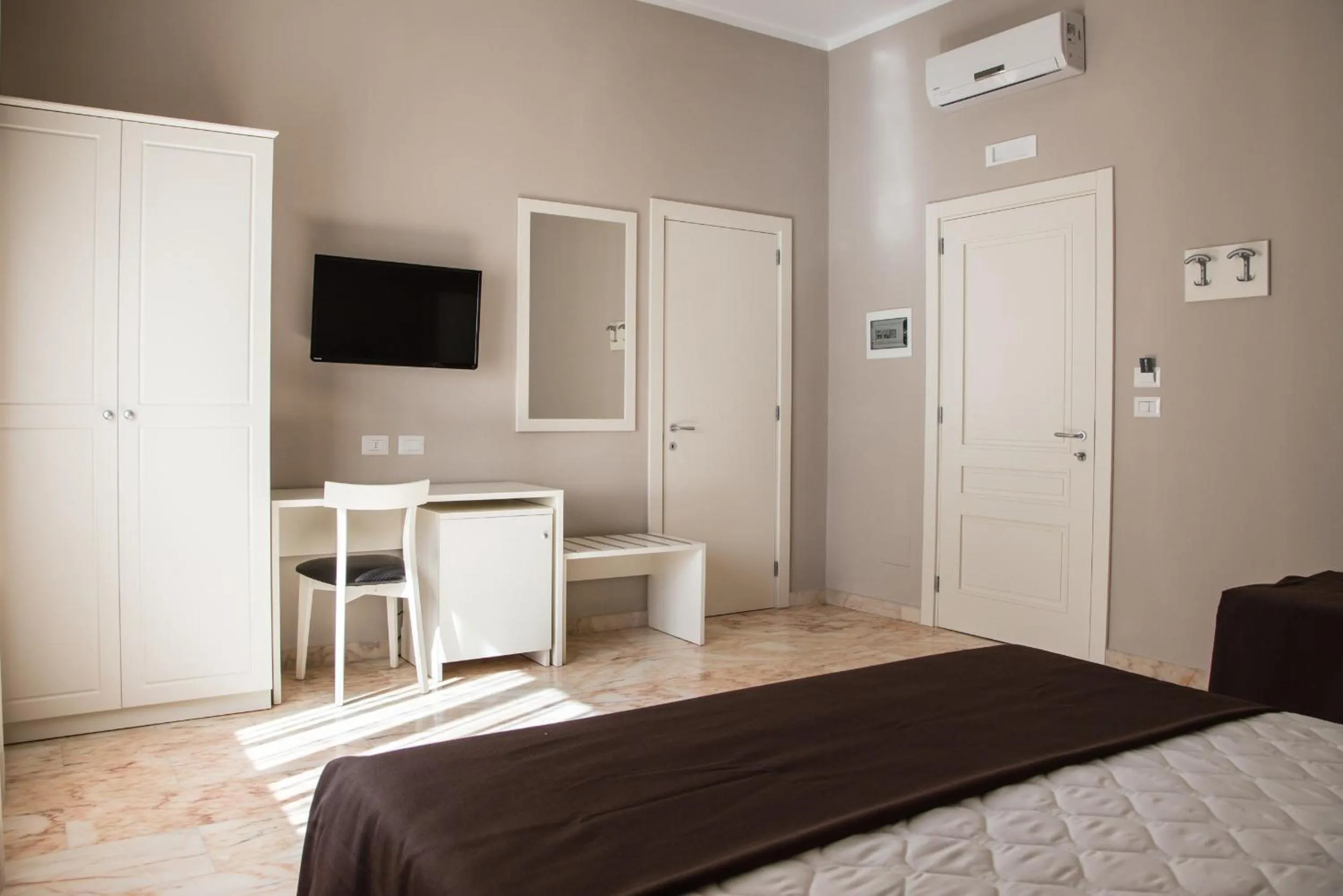 Bed in Faro Bianco Gallipoli Dependance