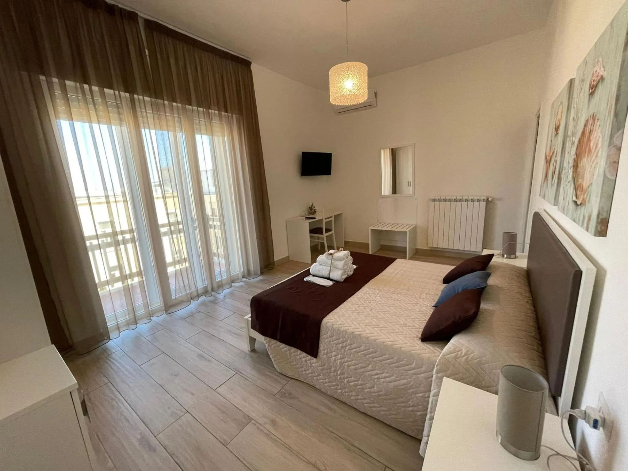 Bed in Faro Bianco Gallipoli Dependance