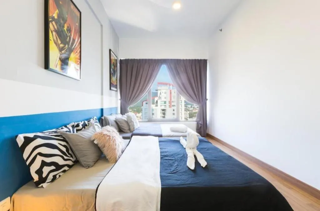 Bed in Georgetown Tropicana 218 Apartment