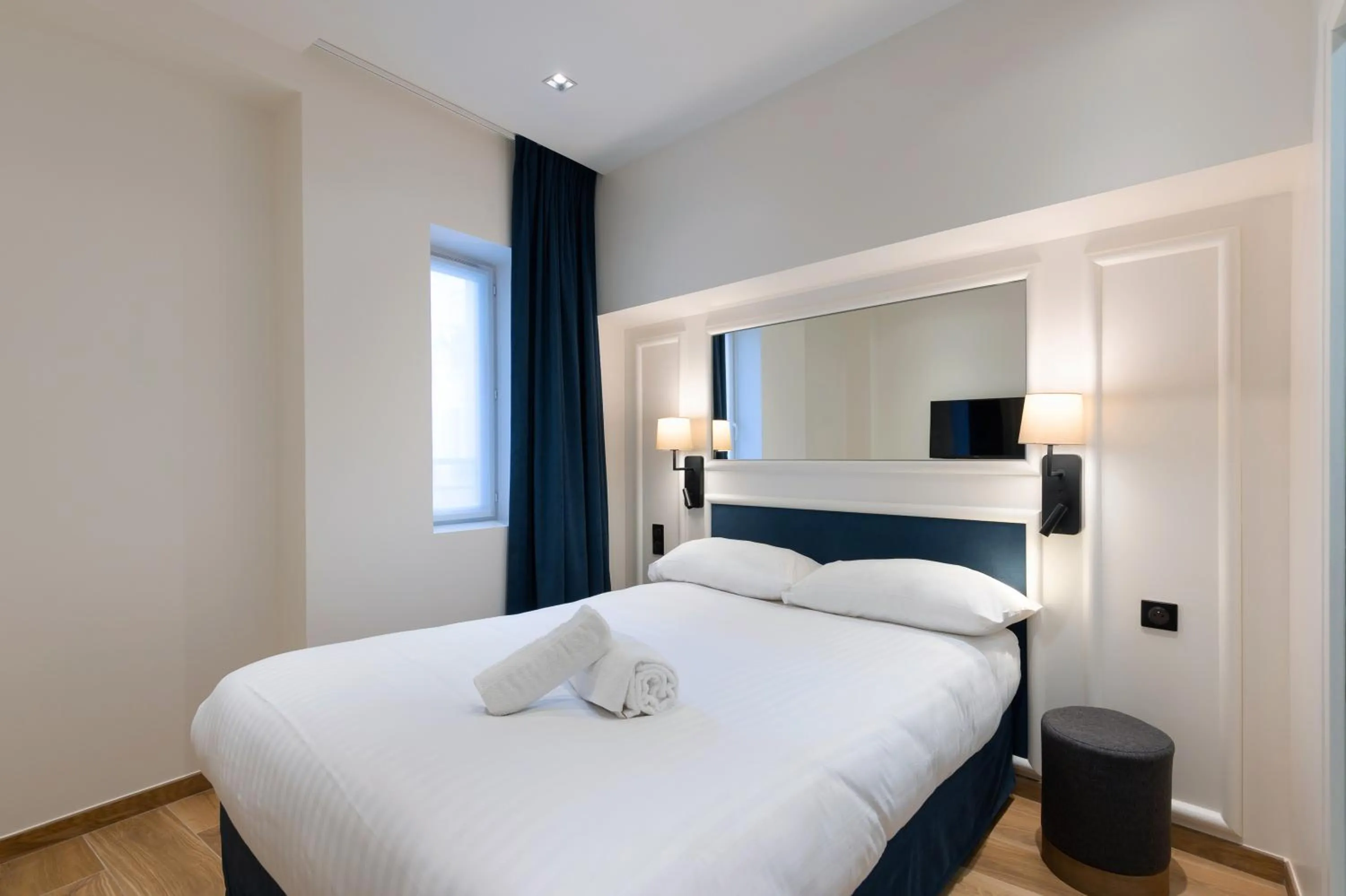 Bed in HOTEL AU COEUR DE REPUBLIQUE