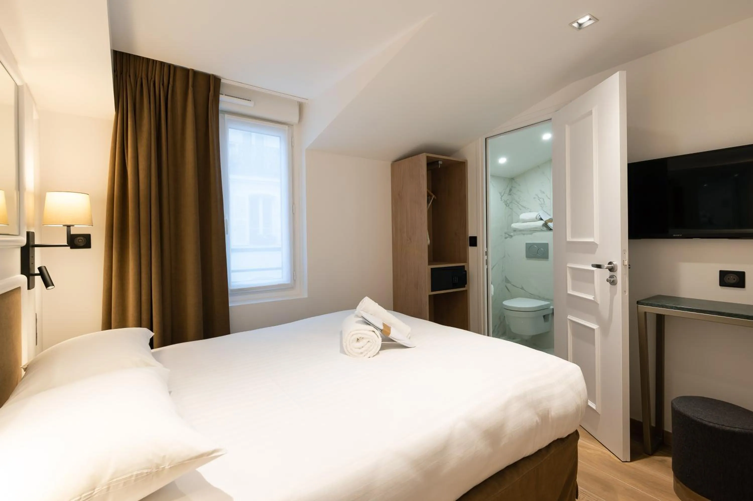 Photo of the whole room, Bed in HOTEL AU COEUR DE REPUBLIQUE