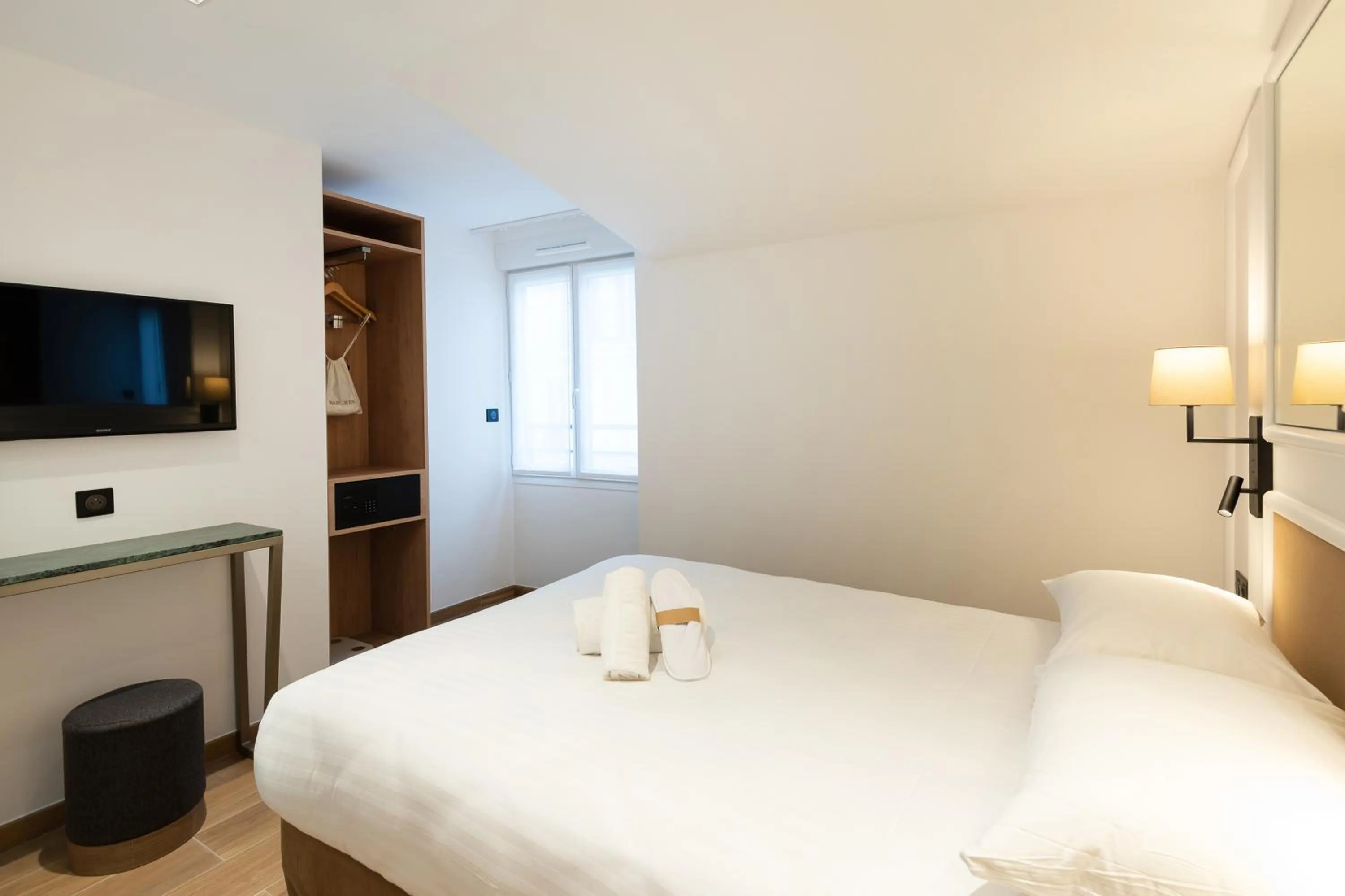 Photo of the whole room, Bed in HOTEL AU COEUR DE REPUBLIQUE