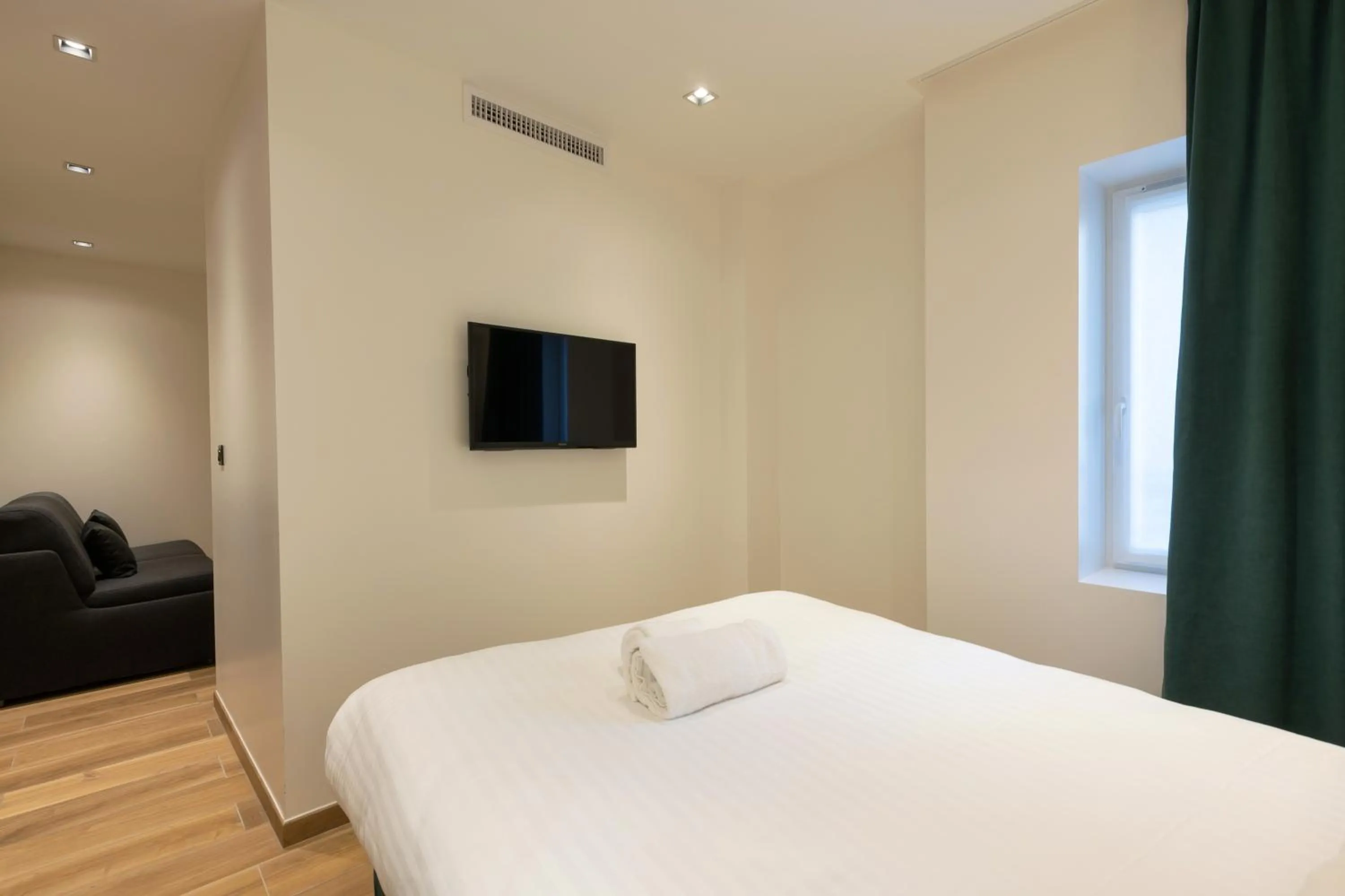 Bed in HOTEL AU COEUR DE REPUBLIQUE