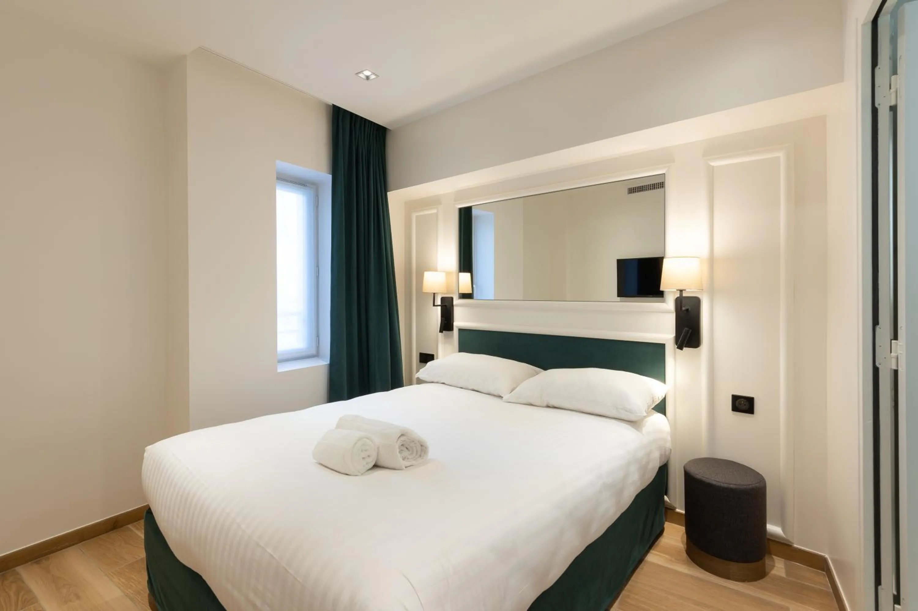 Bed in HOTEL AU COEUR DE REPUBLIQUE