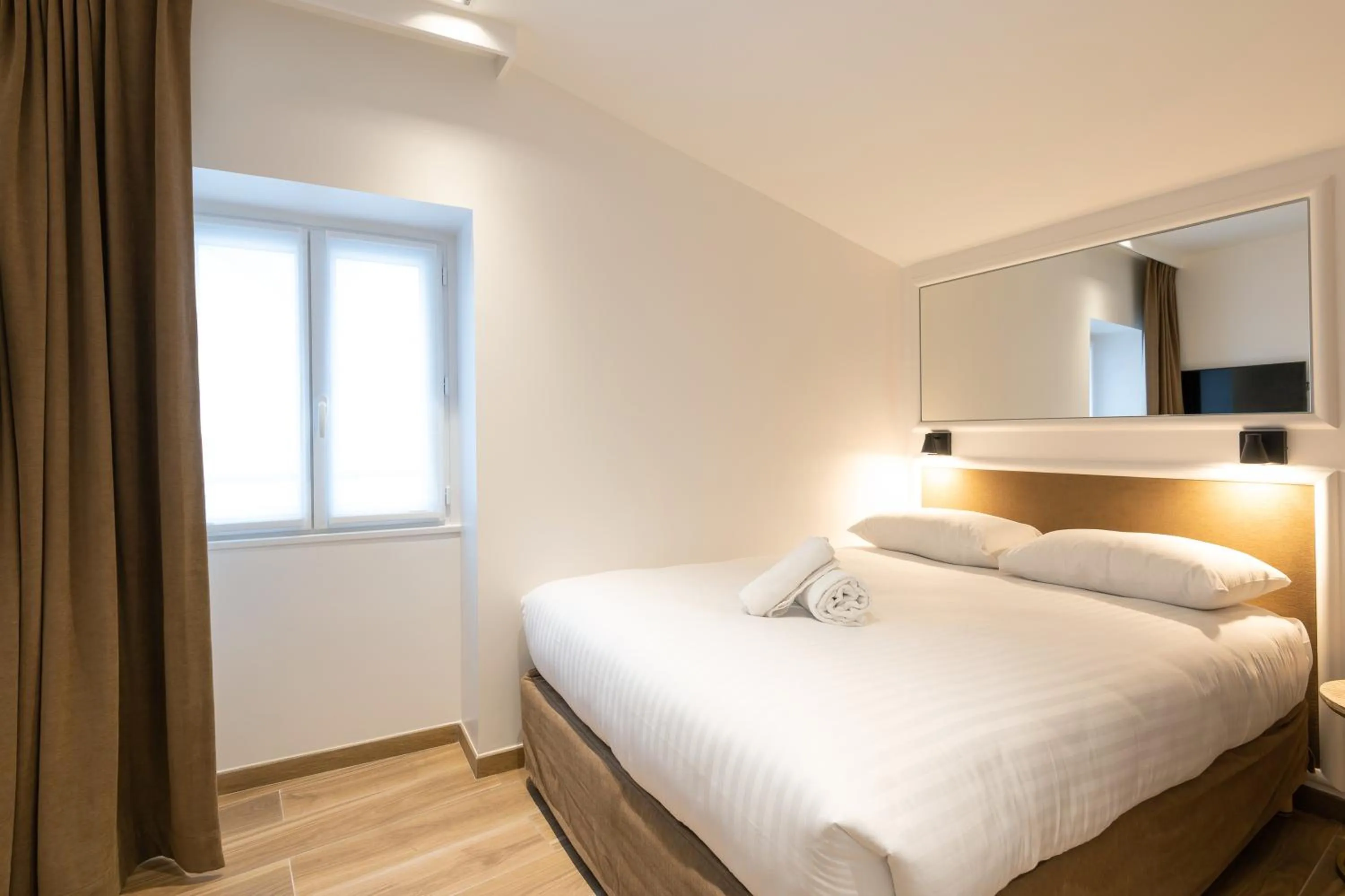 Photo of the whole room, Bed in HOTEL AU COEUR DE REPUBLIQUE